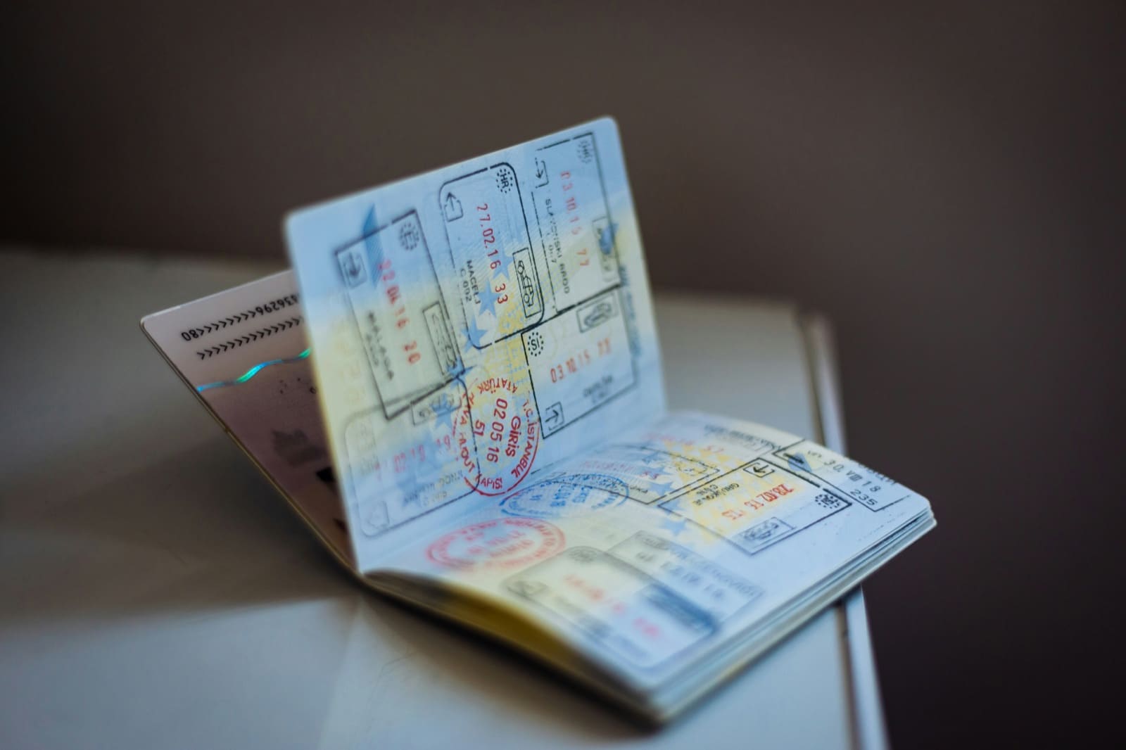 An open passport showing multiple travel stamps