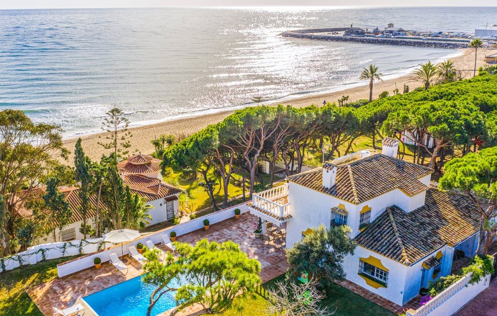 A family villa with a pool and garden beside the beach on Marbella's Golden Mile