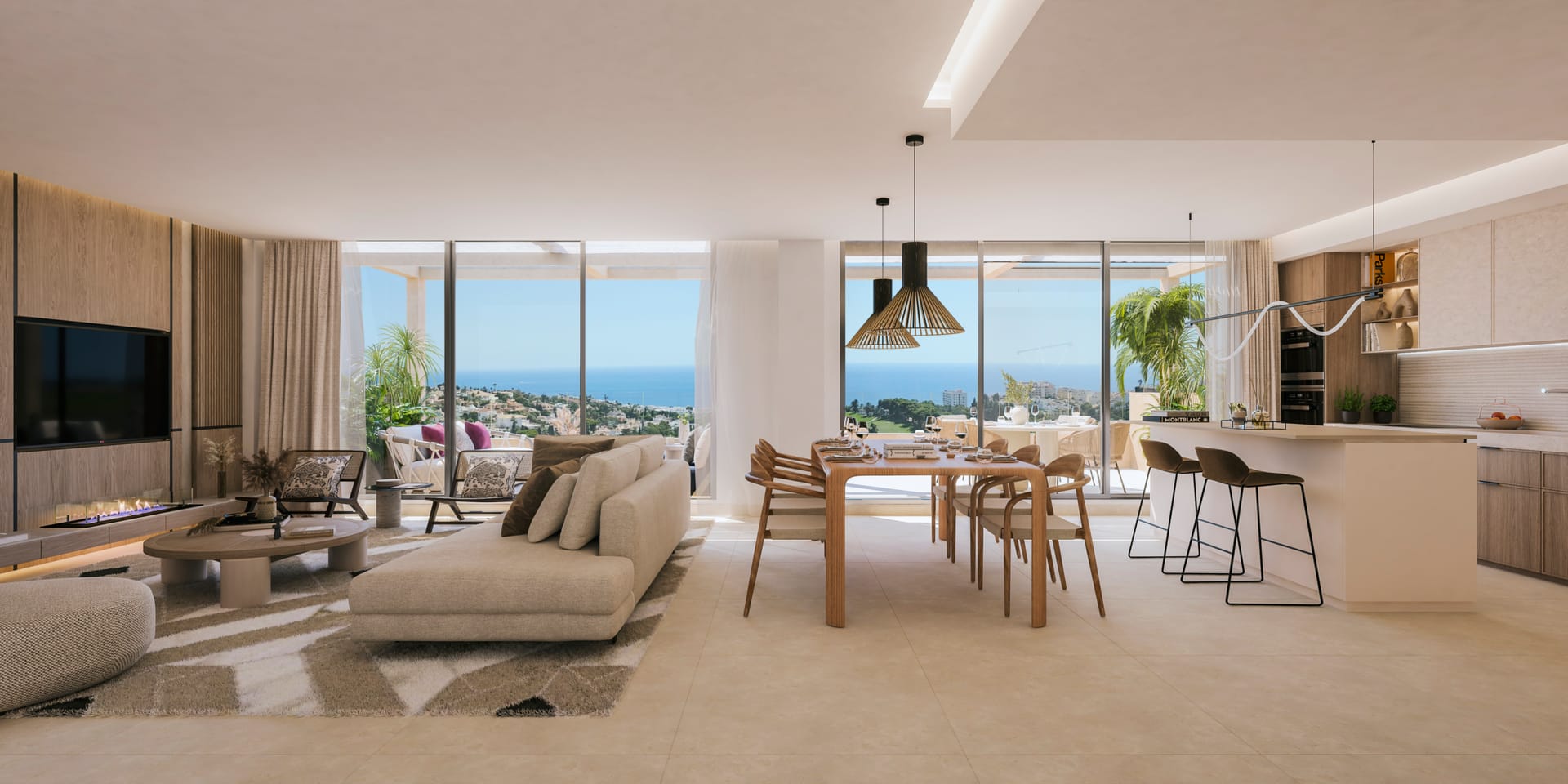 The living room, dining table and kitchen of a penthouse, with glass doors onto the terrace and the sea beyond. Abelias, Torrequebrada, Benalmádena.