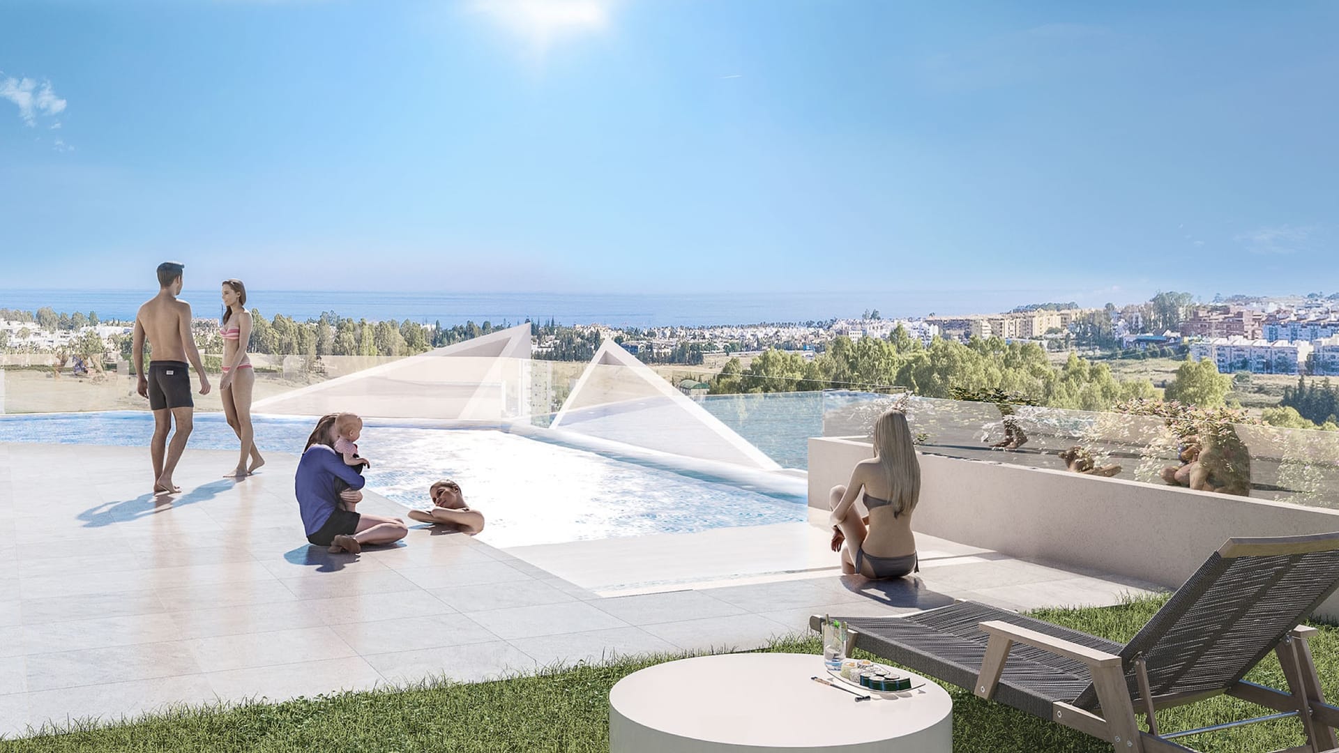 The pool on the roof, with sun loungers and the coast beyond. Albatros XV, Nueva Andalucía, Marbella.