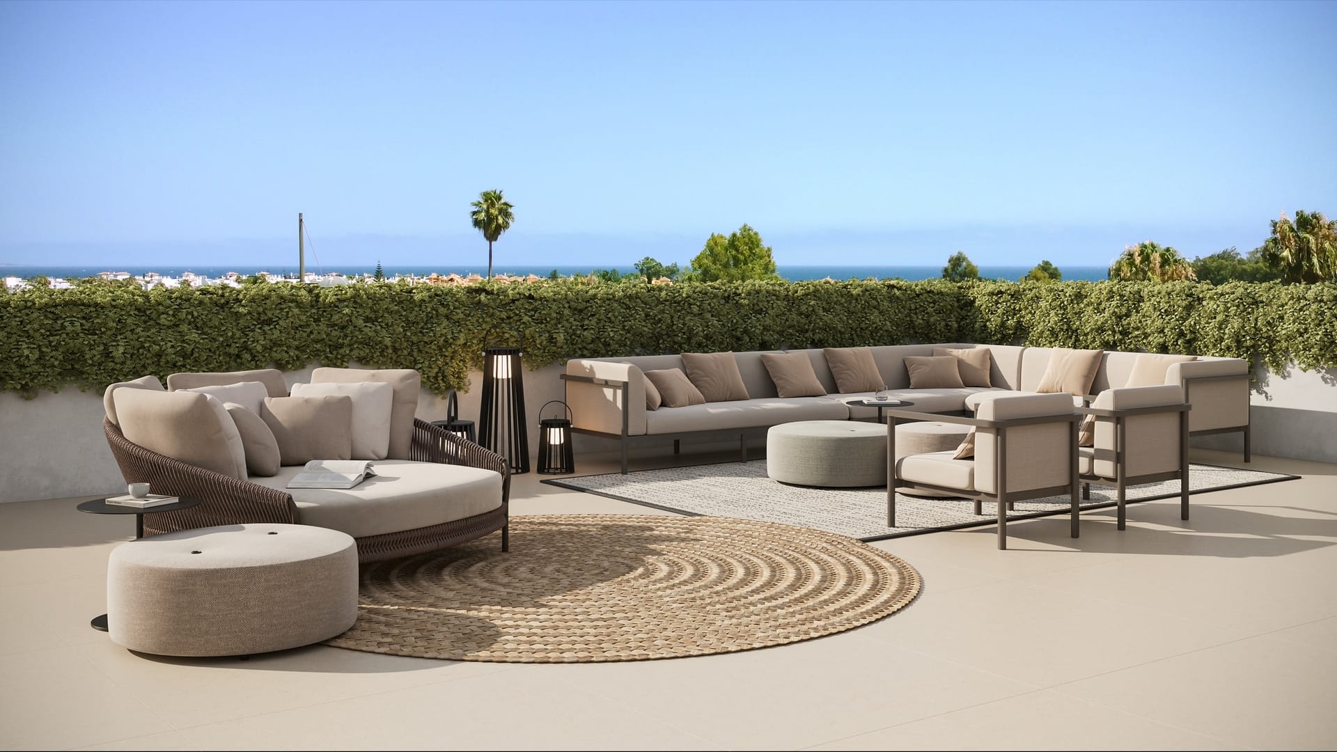 A private roof terrace on an upper-floor apartment, with outdoor sofas and plants. Alcántara del Mar, San Pedro de Alcántara, Marbella.