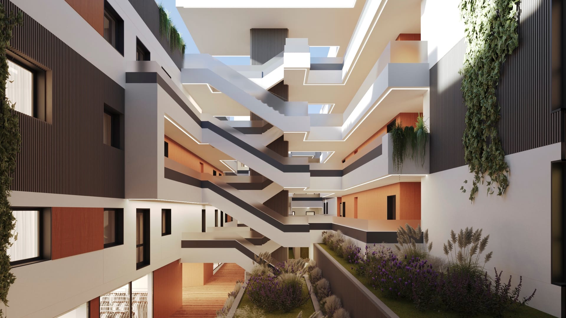 The courtyard in the middle of the building, planted and open to the sky, with the walkways above. Armonía, San Pedro de Alcántara, Marbella.