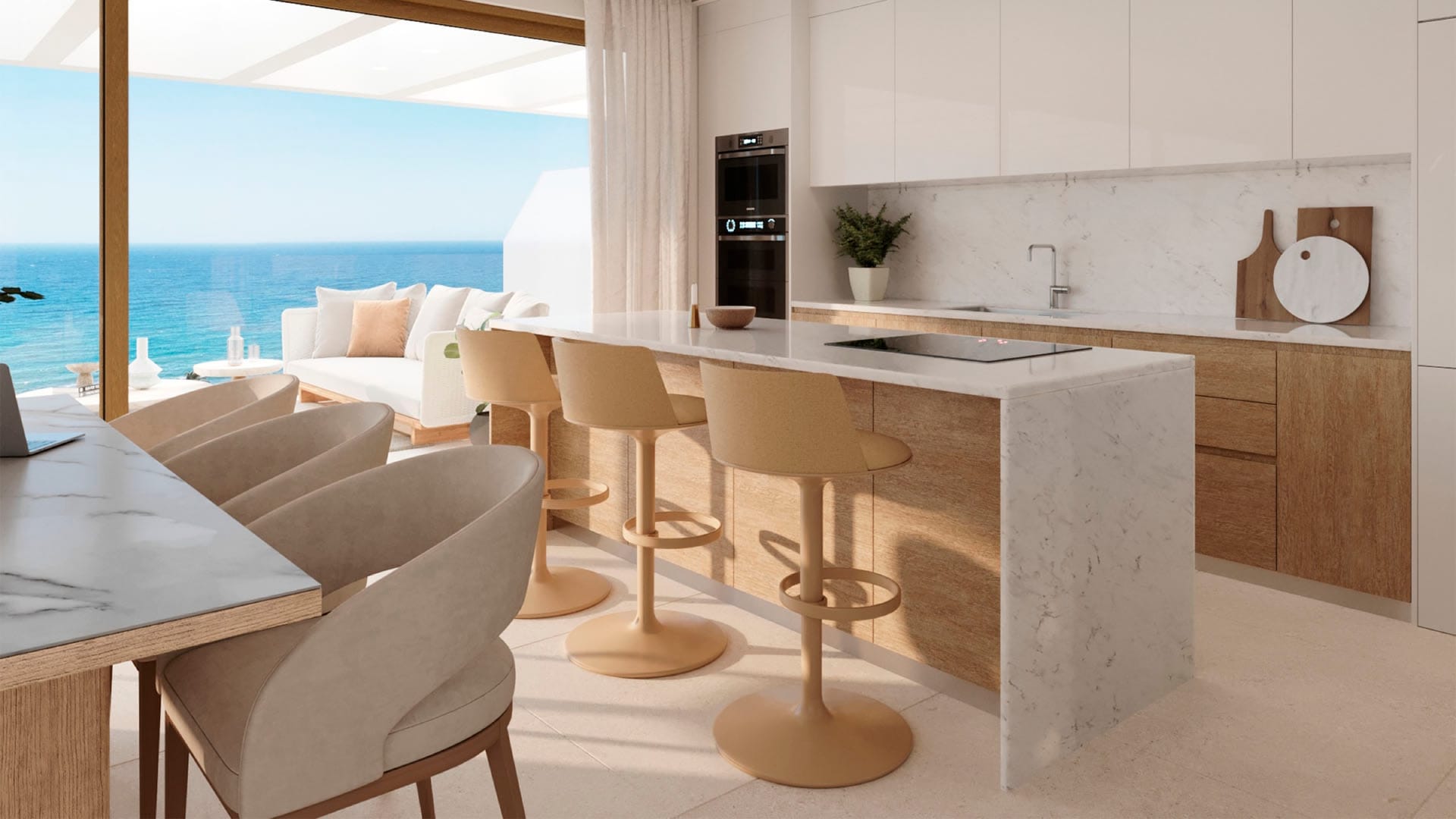 The kitchen, with its island and a view through to the sea. Arosa, Torrenueva, Mijas.