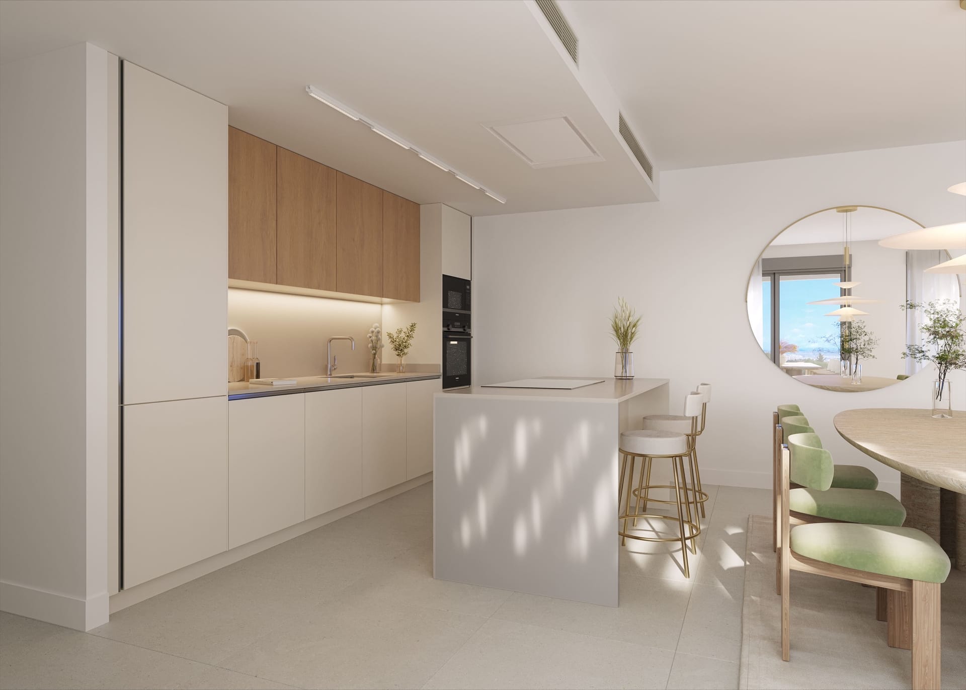 A kitchen with wood-fronted wall cupboards and a white island, open to the dining table. Australy Aures, La Resina, Estepona.