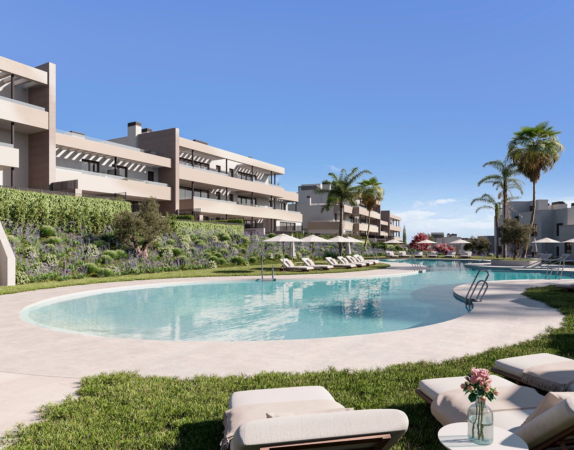 The pool and its lawns, with the apartments behind. Bliss Homes, Casares Costa, Casares.