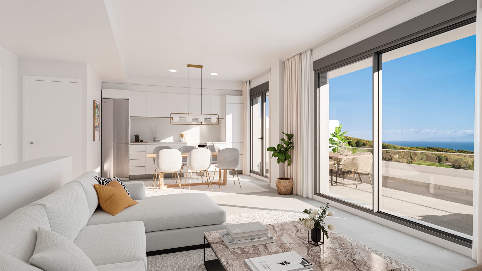 The living room and kitchen in one open space, with white kitchen units and sliding glass doors onto a terrace. Blue Marine, La Chullera, Manilva.