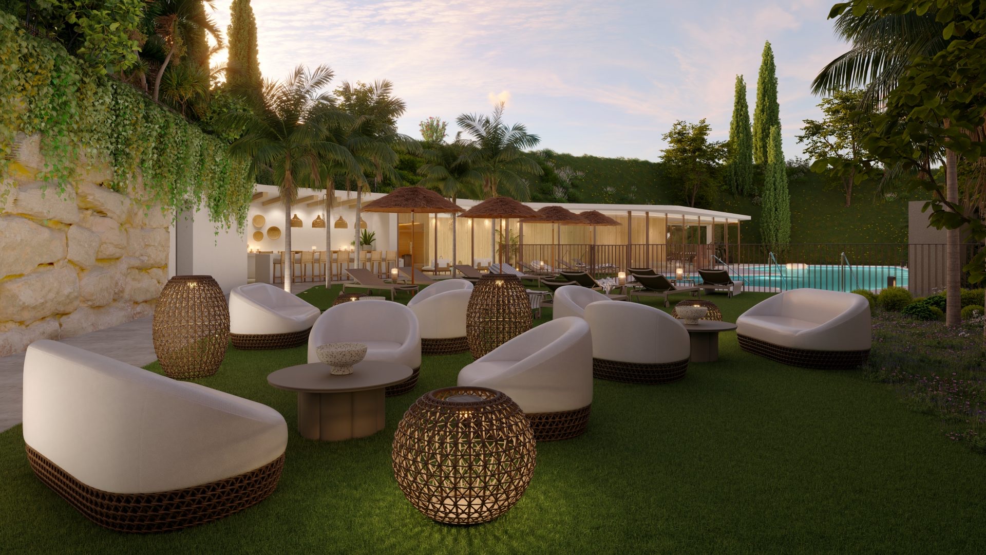 The shared lounge area at dusk, with the pool and its sun umbrellas just beyond. Cala Serena Sun, Ensanche de La Cala, La Cala de Mijas.