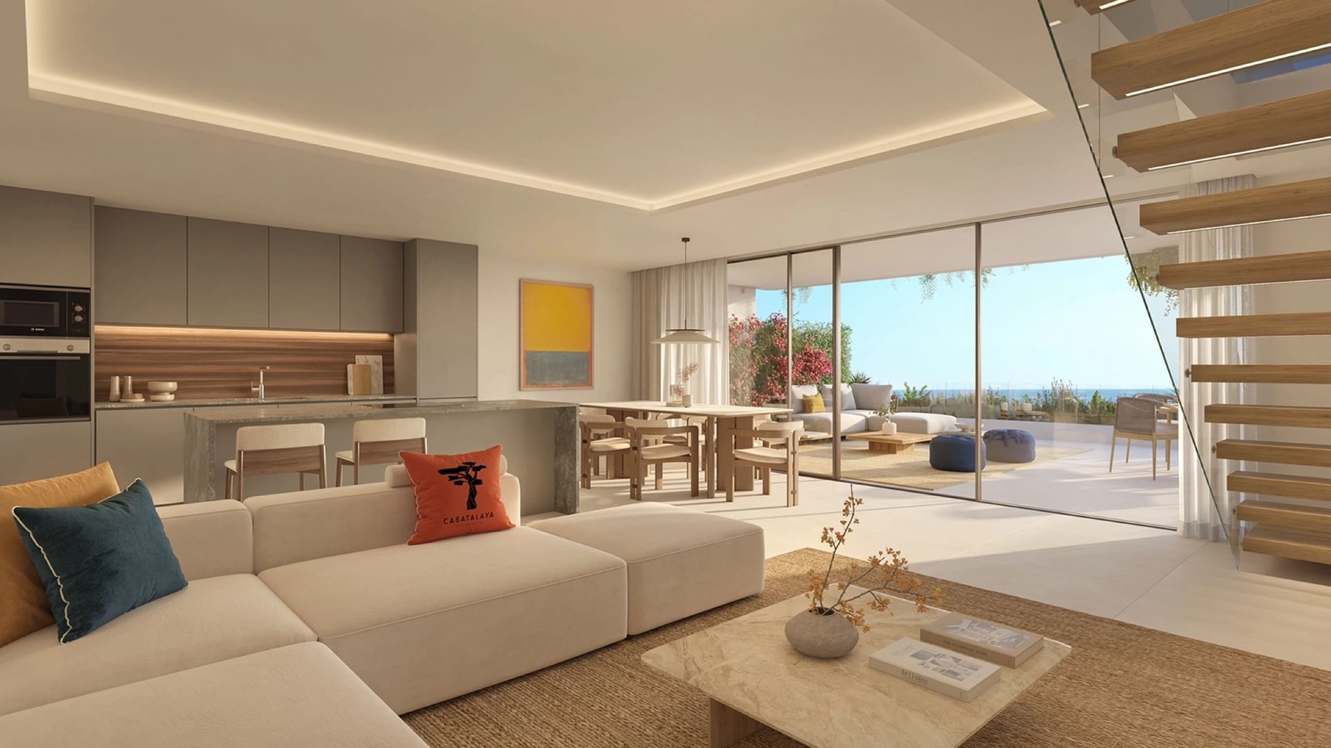 An open-plan living room and kitchen, with the terrace beyond the glass. Casatalaya Residences, Torremuelle, Benalmádena.