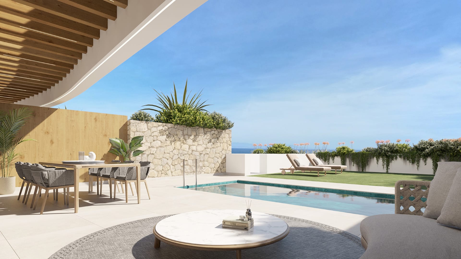 A ground floor garden with its own pool and a covered dining area. Elysea Suites, El Chaparral, Mijas.