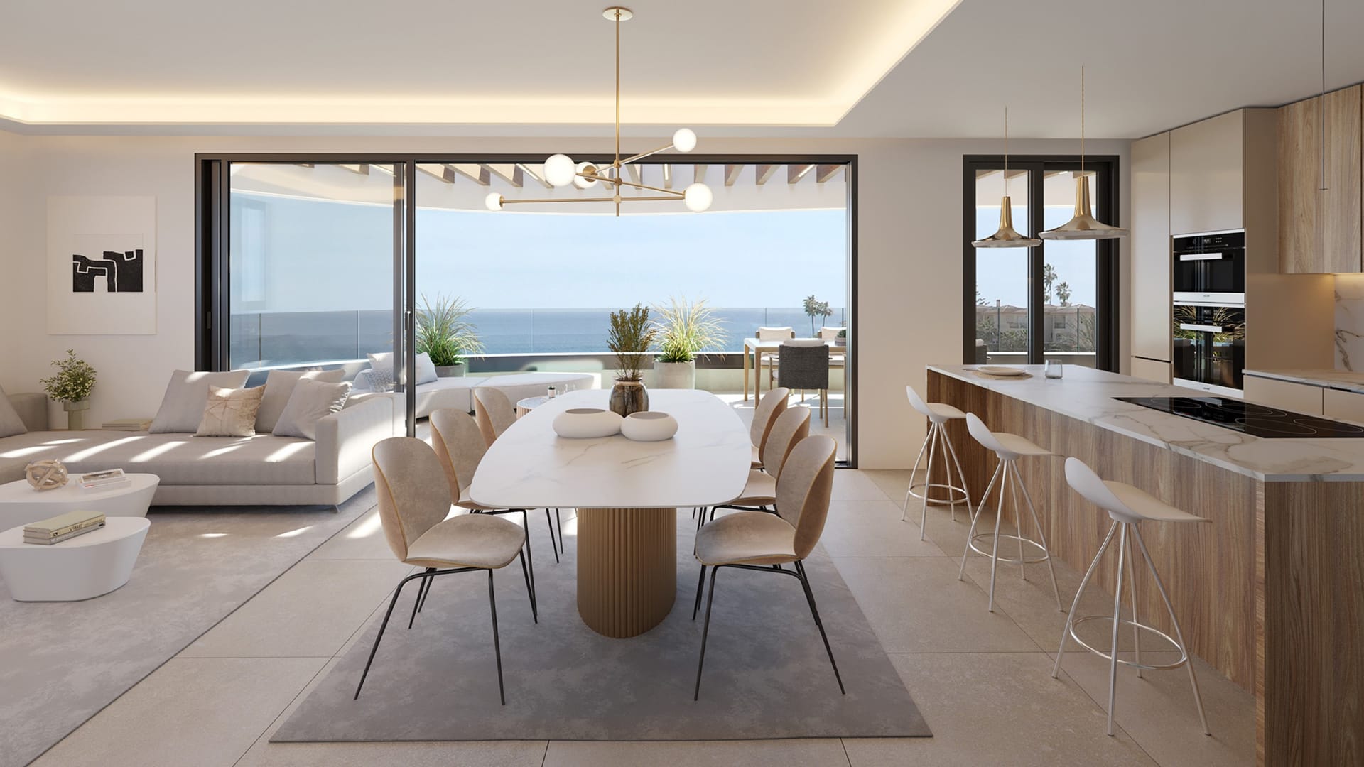 An open kitchen and dining room with a view of the sea. Elysea Suites, El Chaparral, Mijas.
