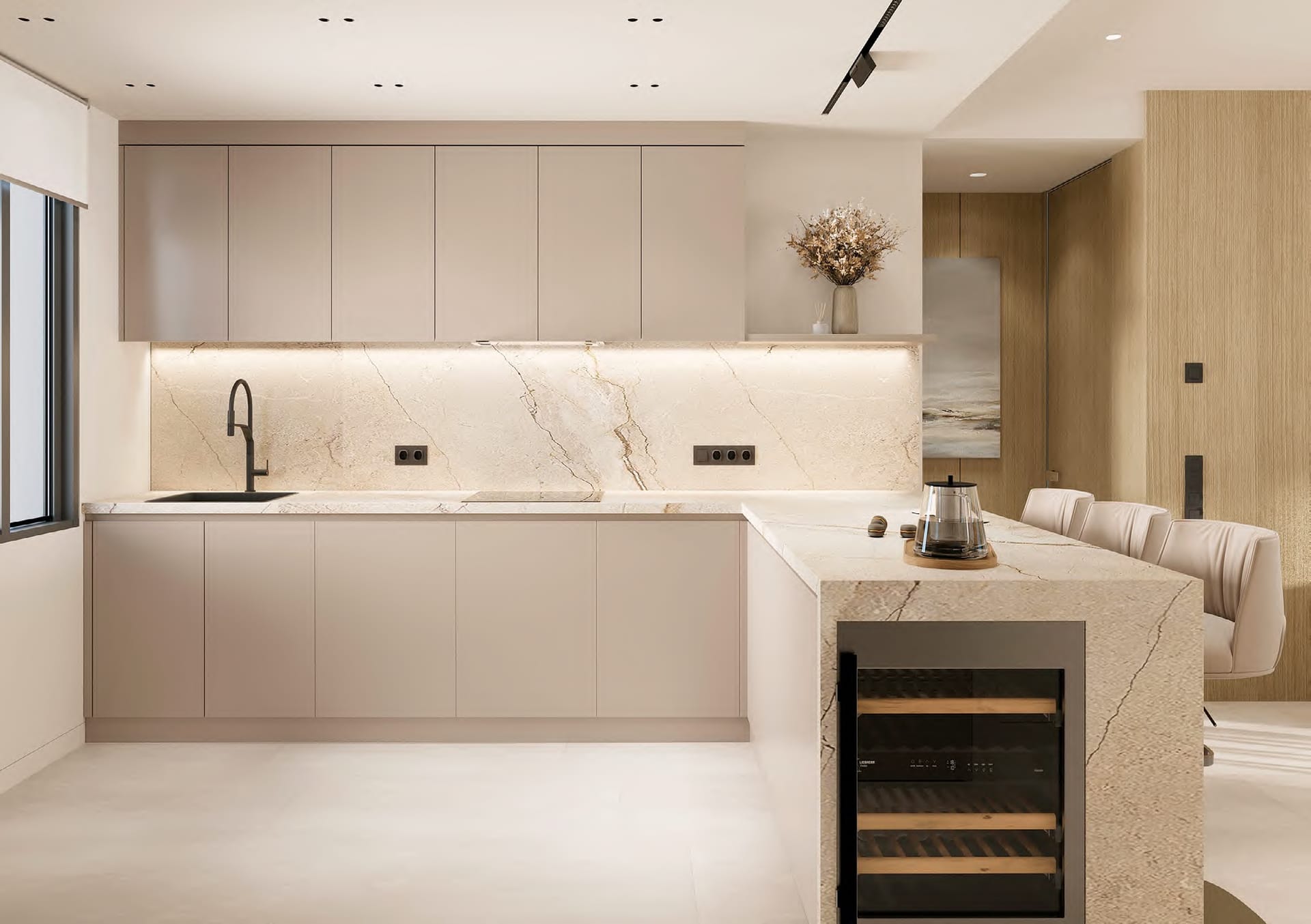 A kitchen with pale units, a porcelain worktop and a wine cooler built into the end of the island. Essence Residence, Cancelada, Estepona.