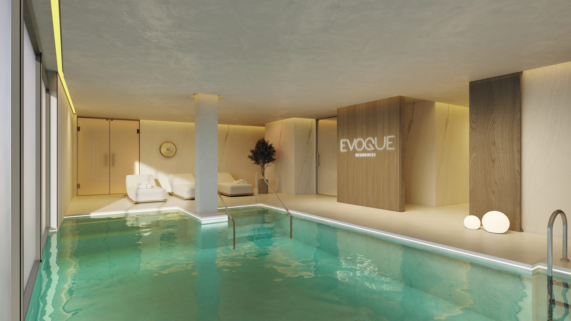 The indoor pool, lit through the evening and open through the colder months. Evoque Residences, El Higuerón, Fuengirola.