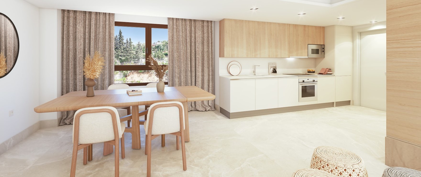 The kitchen along one wall, with tall pale oak units and white cupboards, and the dining table in front of it. Fuente Lirios, Calle Fuente de Lirios, Benahavís.