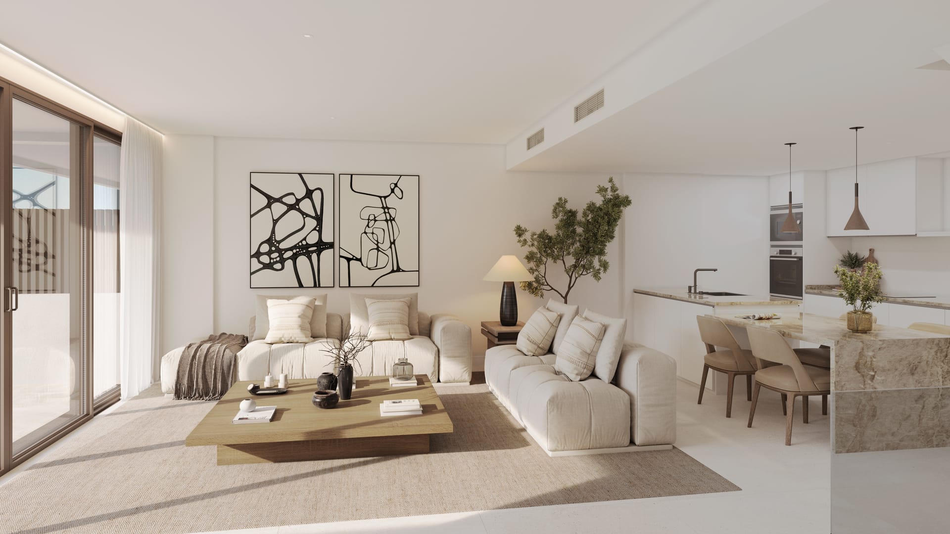 The living room and kitchen in one open room, with a stone-topped island between them and sliding doors onto the terrace. Kala Residences, El Higuerón, Fuengirola.