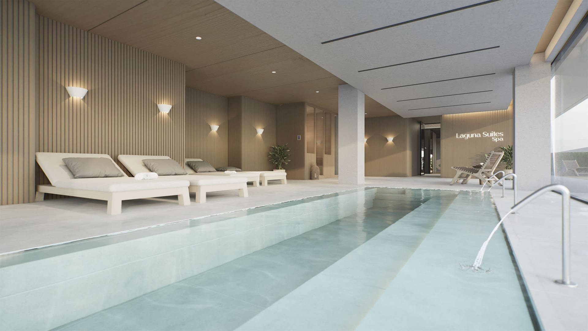 The spa’s indoor pool, with water jets along one edge and loungers against a slatted timber wall. Laguna Suites, Las Lagunas de Mijas, Mijas.