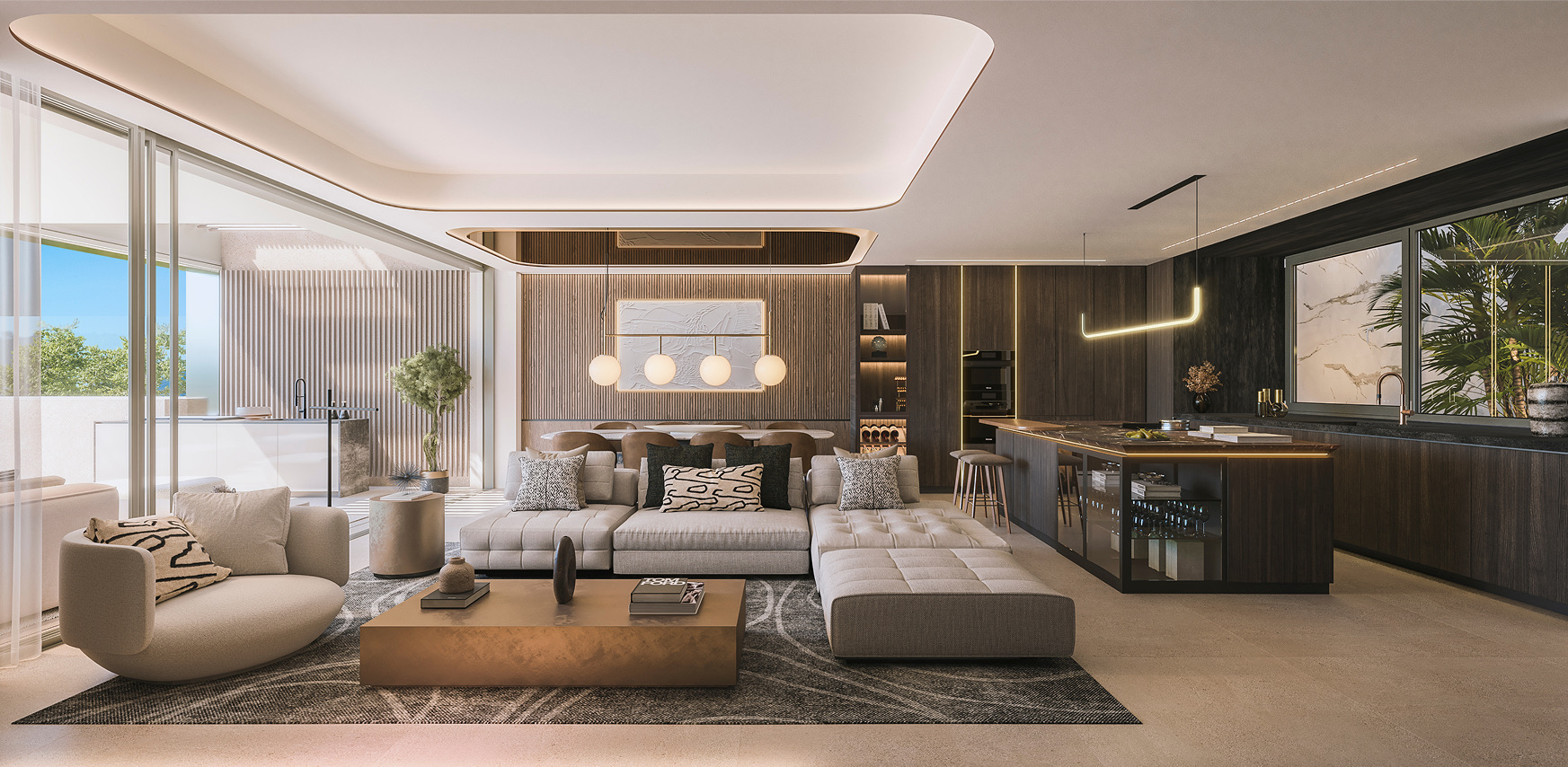 A living room with an L-shaped sofa, full-height glazing along the left-hand wall and a kitchen island in dark wood with stools. Livermore, El Morlaco, Málaga.