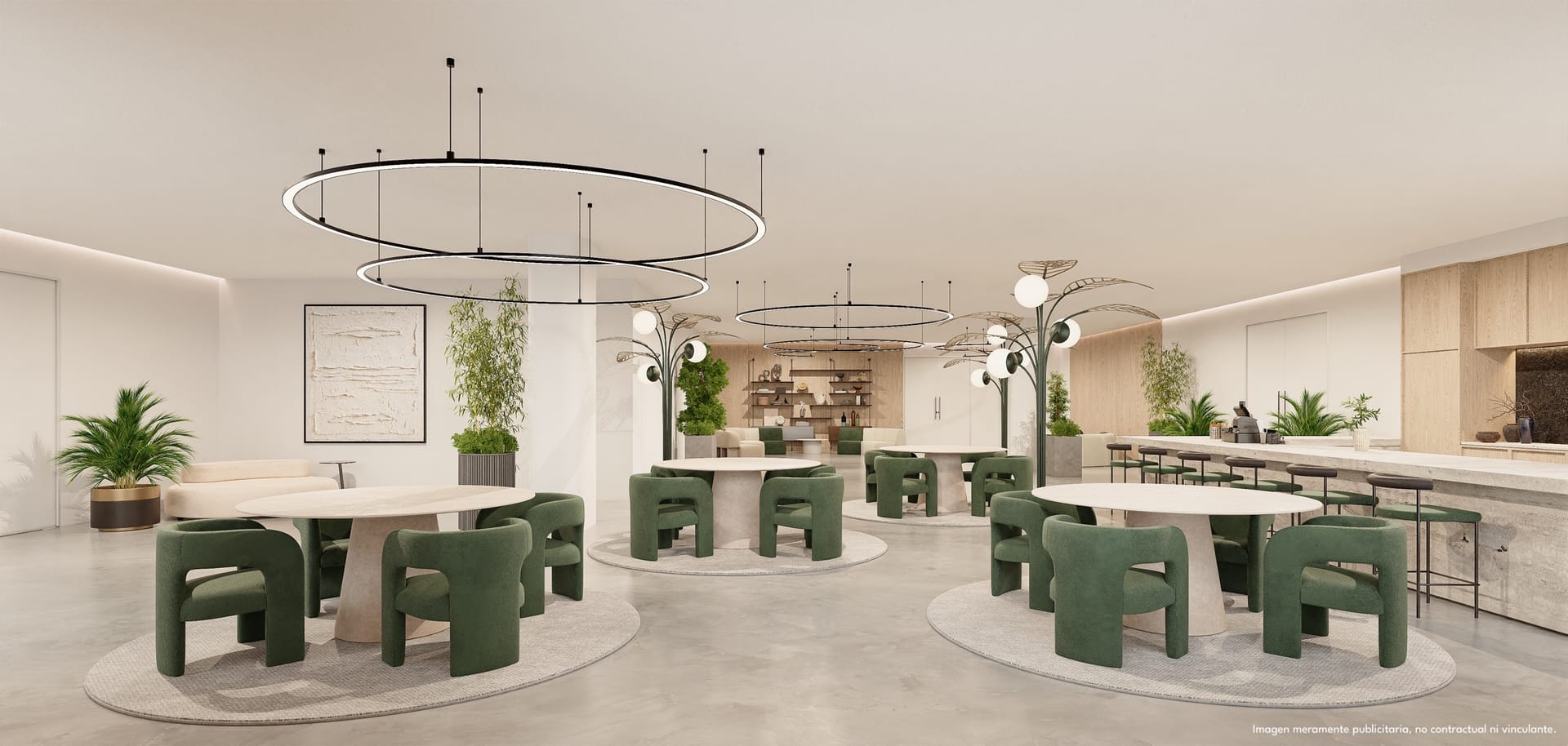 The residents’ lounge, with round tables and green armchairs under a ring of lights. Lomas Unique, El Higuerón, Fuengirola.