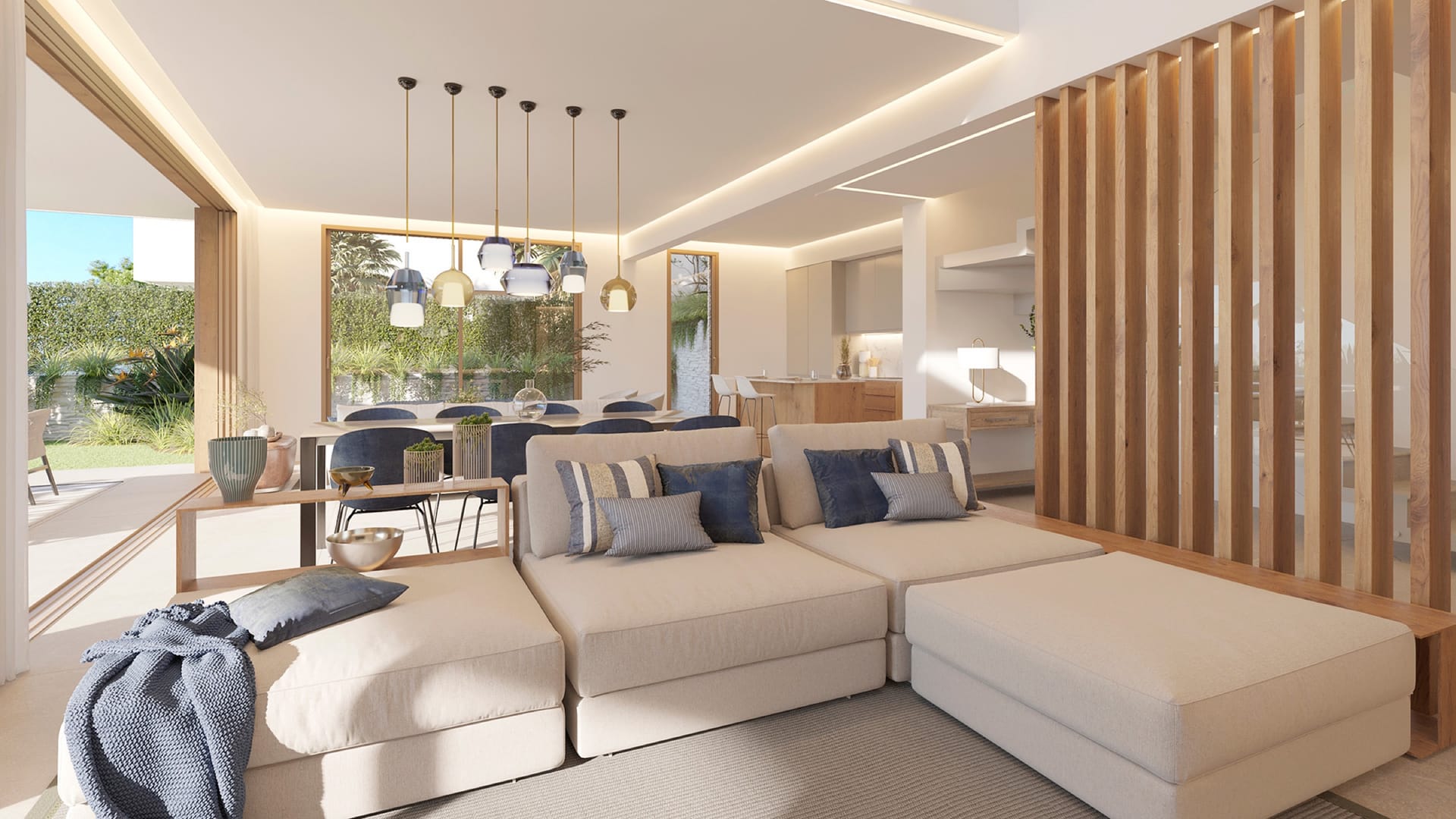 An open living room and dining area with a garden beyond. Lyra Residences, El Campanario, Estepona.