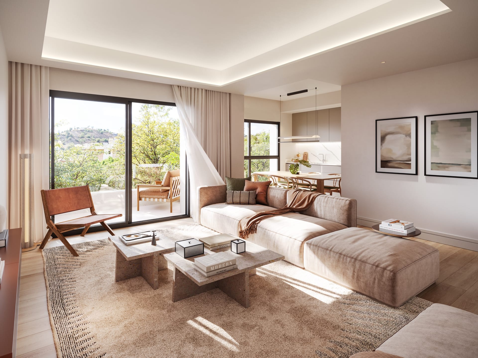 A living room with a sofa and stone side tables, a sliding door to a terrace, and the kitchen and dining area beyond. Miramar 34, El Limonar, Málaga.