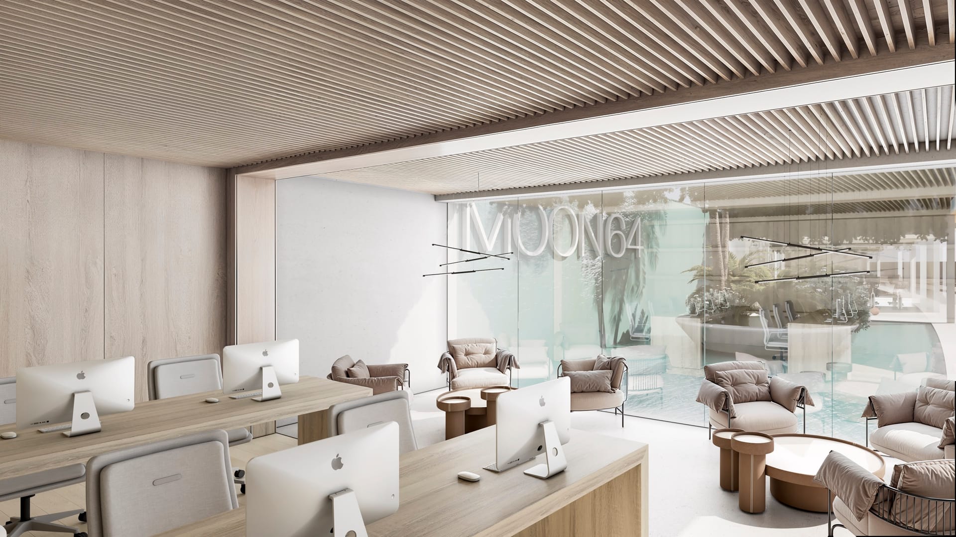 The coworking room, with desks along one side and armchairs by the windows. Moon 64, Los Hidalgos, Manilva.
