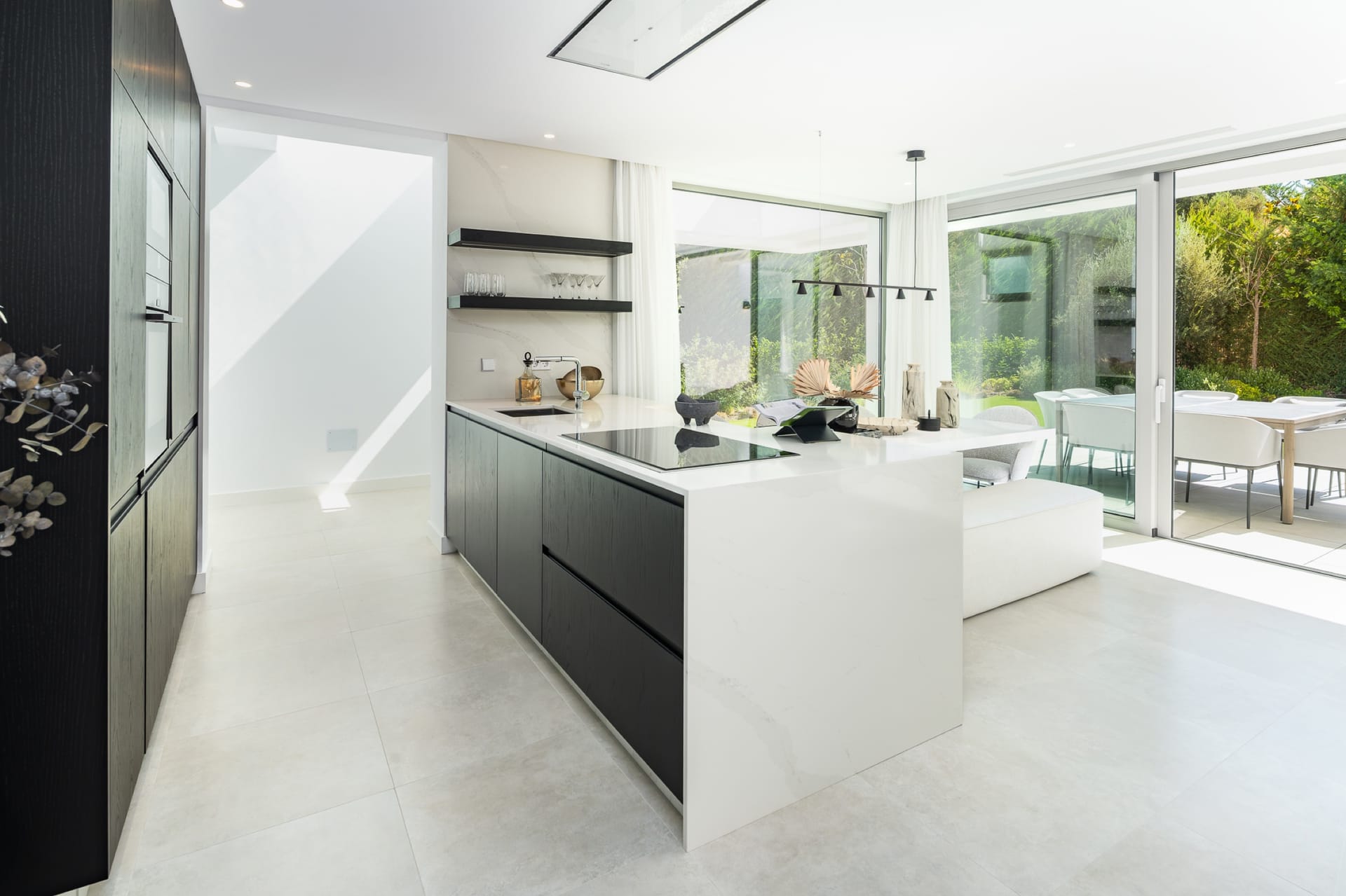 A kitchen with an island, opening onto the garden. Nine in Paradise, El Paraíso, Estepona.