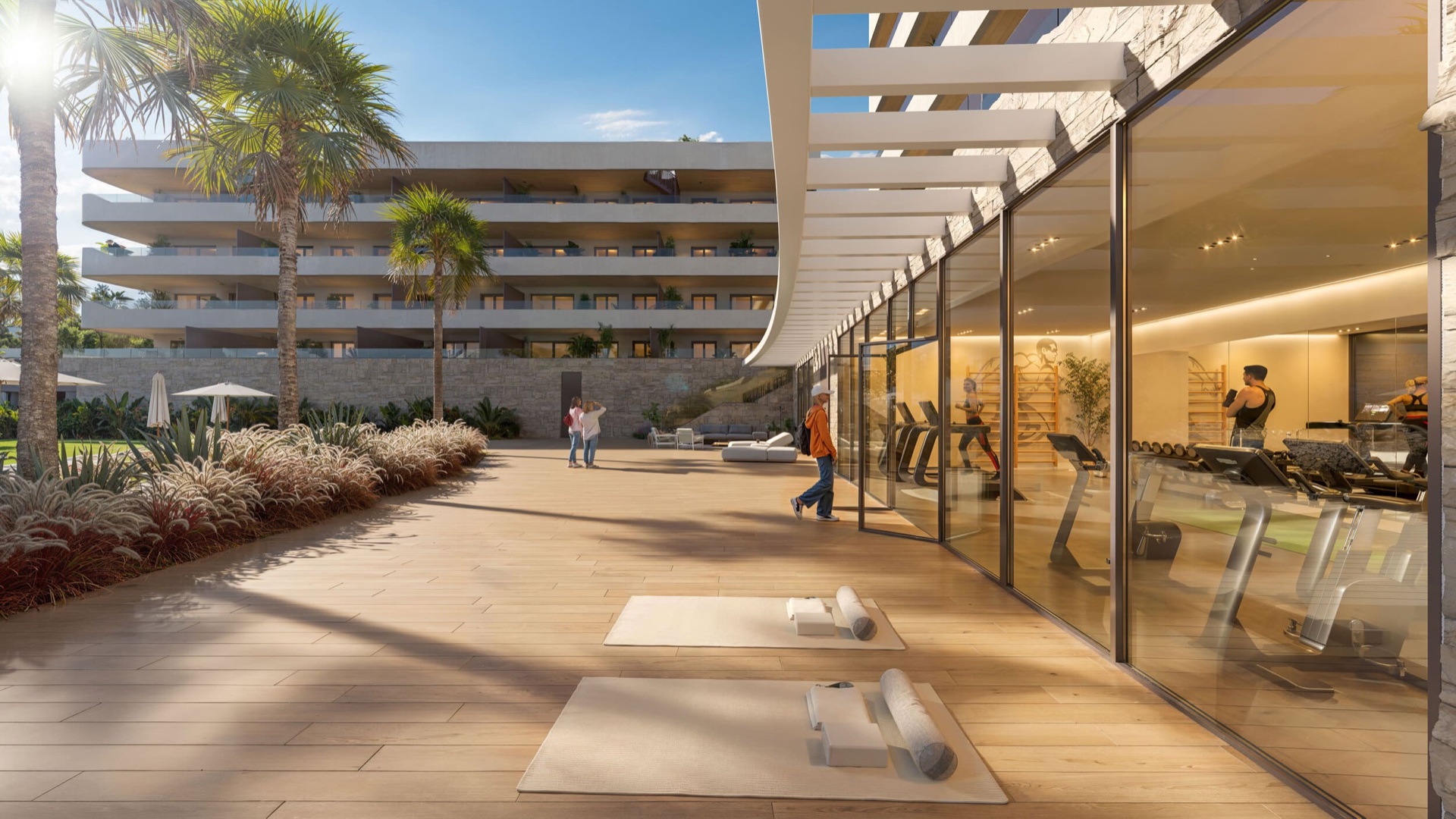 The gym, glazed the full length of one side, seen from the garden path that runs past it. Ocean Garden, Los Pacos, Fuengirola.
