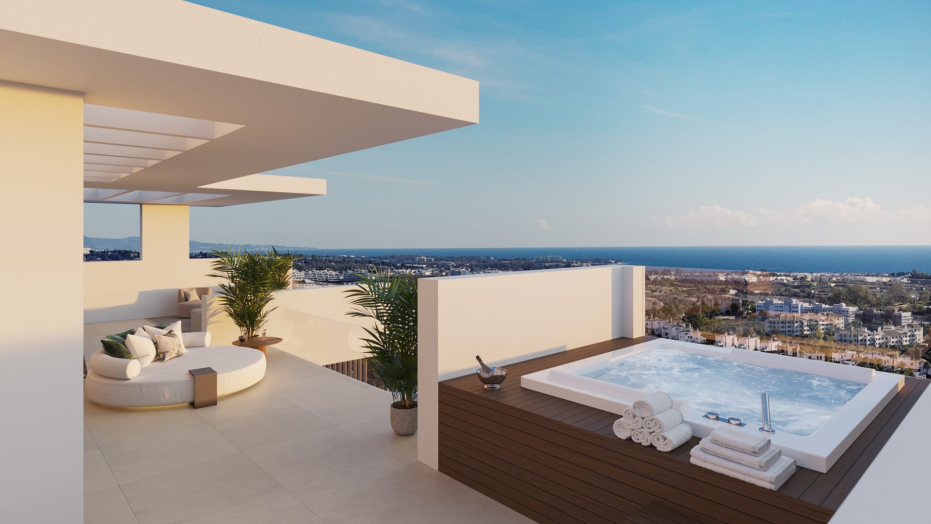A roof terrace with a hot tub and a view of the coast. Ocyan Villas, La Resina, Estepona.