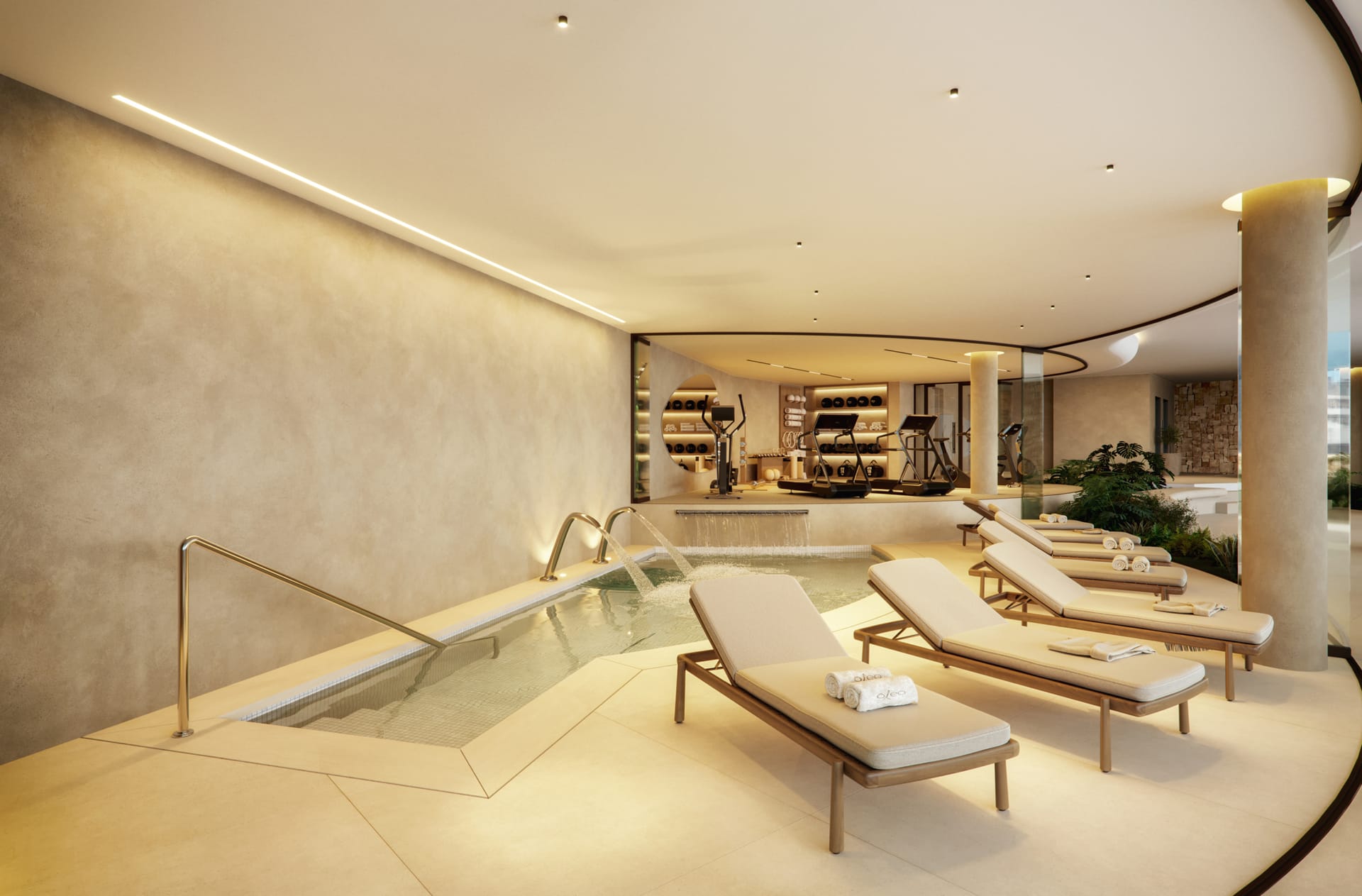 The indoor pool, with loungers along one side and the gym at the far end. Óleo, Carvajal, Fuengirola.