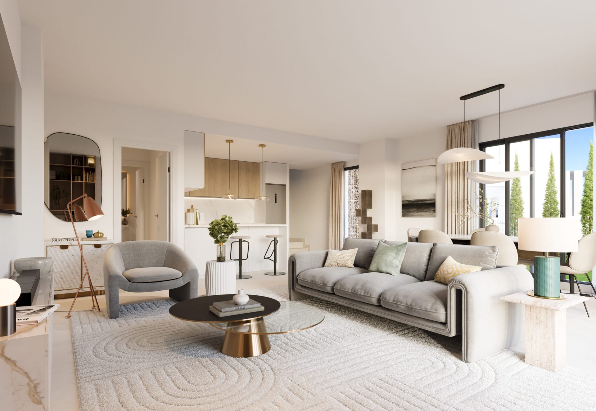 A living room with a grey sofa and armchair round a low table, and the kitchen beyond. Proa, Lagos, Vélez-Málaga.