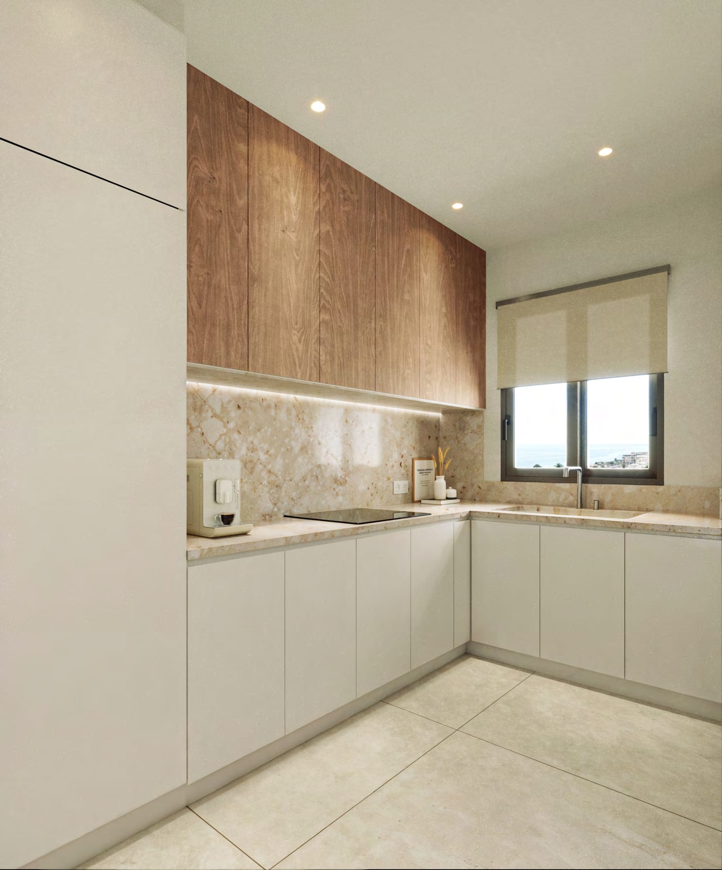 The kitchen, with white base units, wood-finish wall cupboards and a window above the worktop. Residencial Peñoncillo, El Peñoncillo, Torrox.