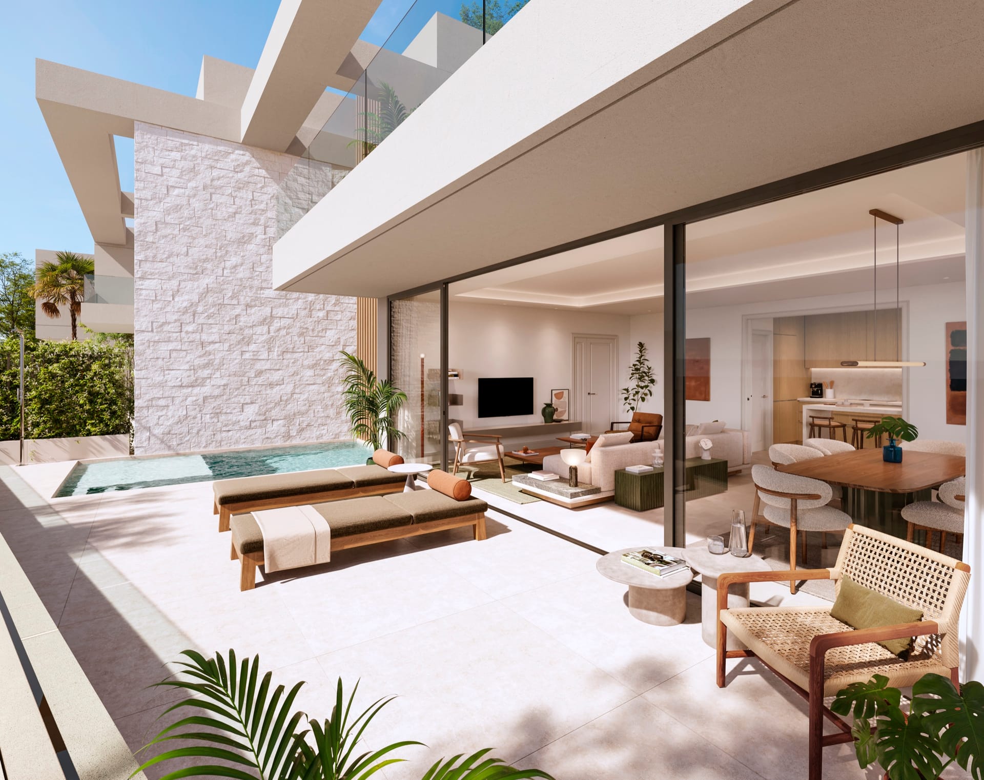 A terrace with a small pool and loungers, opening through sliding glass to the living and dining room. San Federico, Pedregalejo, Málaga.