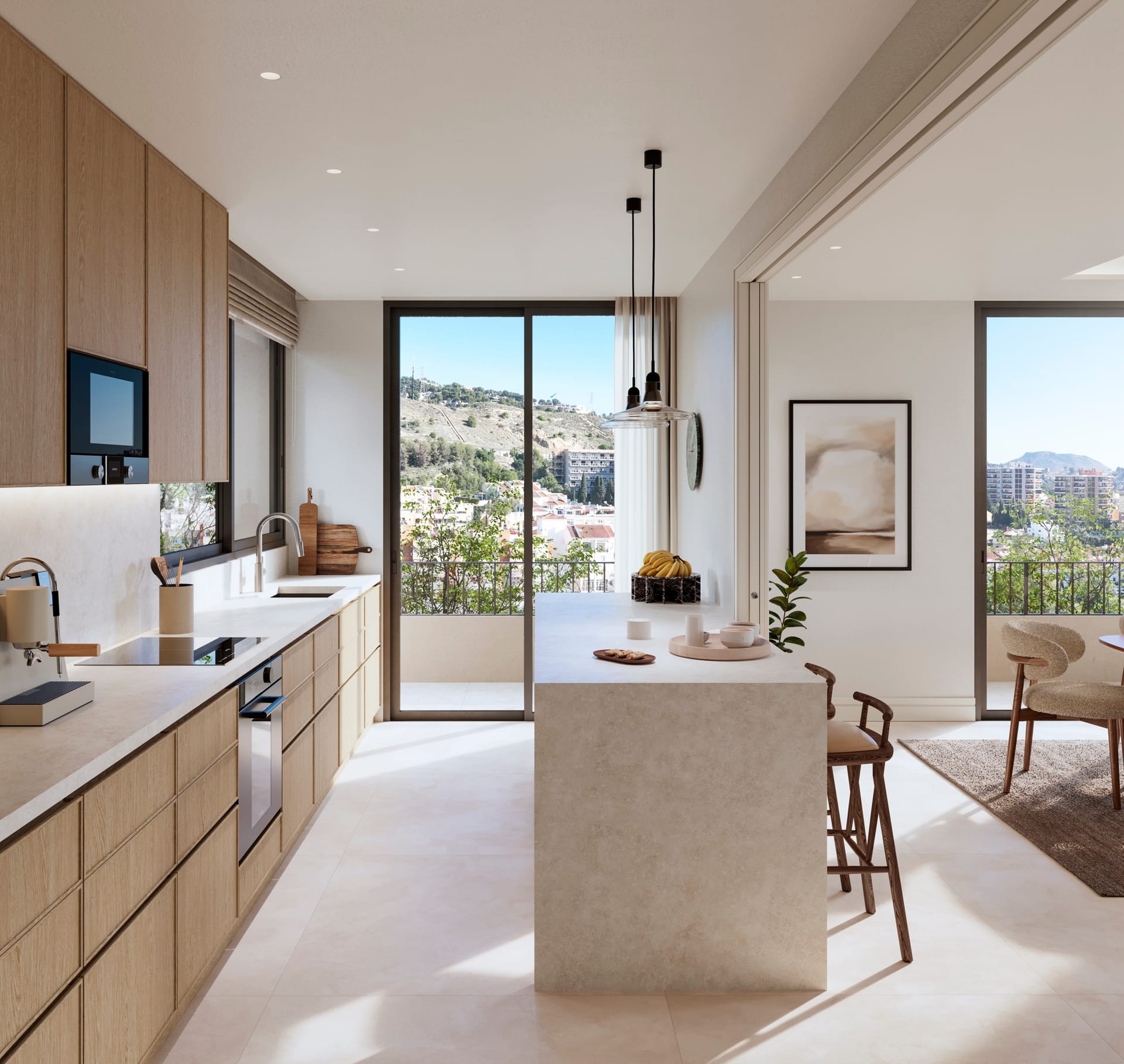 A kitchen with pale wood units, a stone island with stools, and a window looking out over the city. San Federico, Pedregalejo, Málaga.