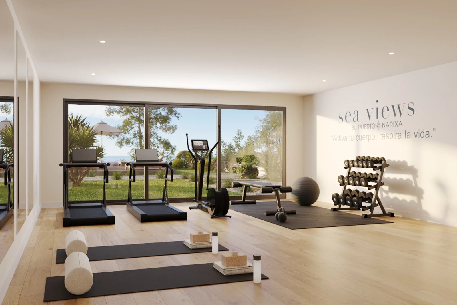 The gym, with a glazed wall onto the planting outside. Sea Views, Cerro Lago, Torrox.