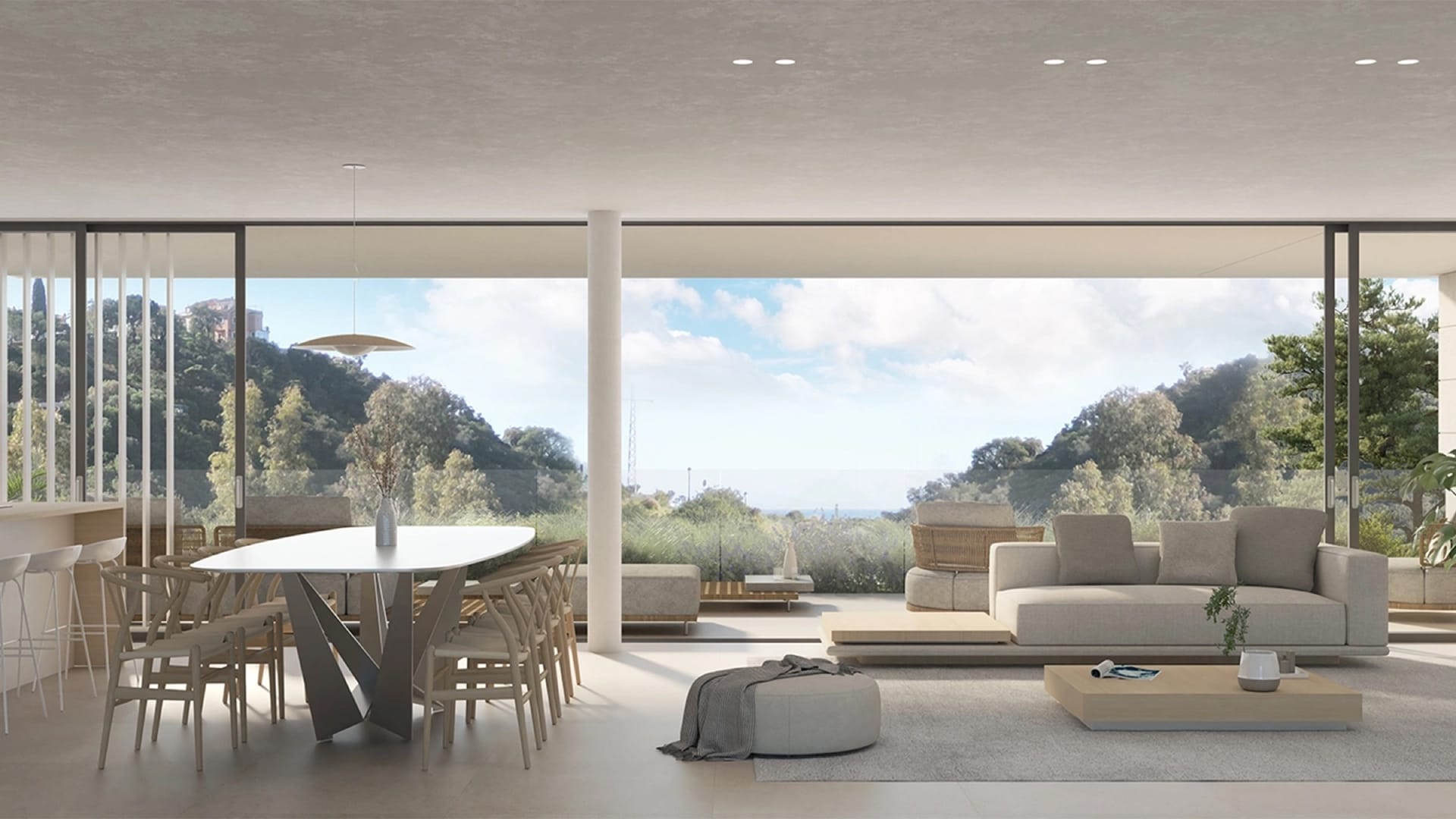 An open living and dining room with a view of the hills. Sira Homes, Elviria, Marbella.