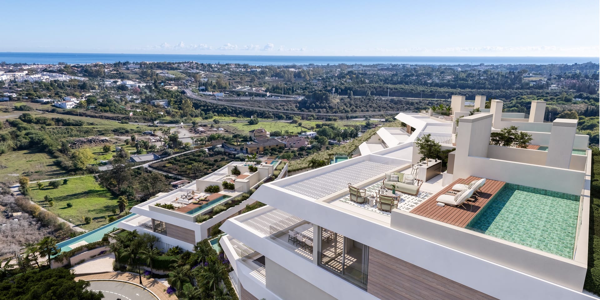 A penthouse roof terrace with a private pool, looking over the golf valley to the sea. Solenne, Los Almendros, Benahavís.
