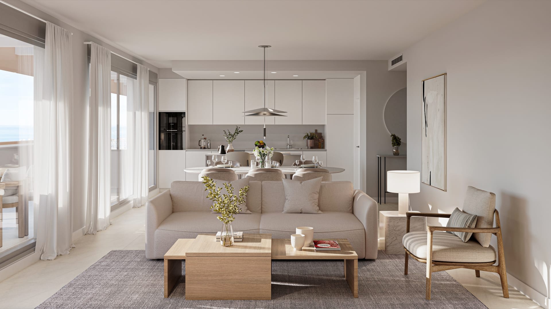 A living room with the dining table and white kitchen units behind it. South Sand, Las Mesas, Estepona.
