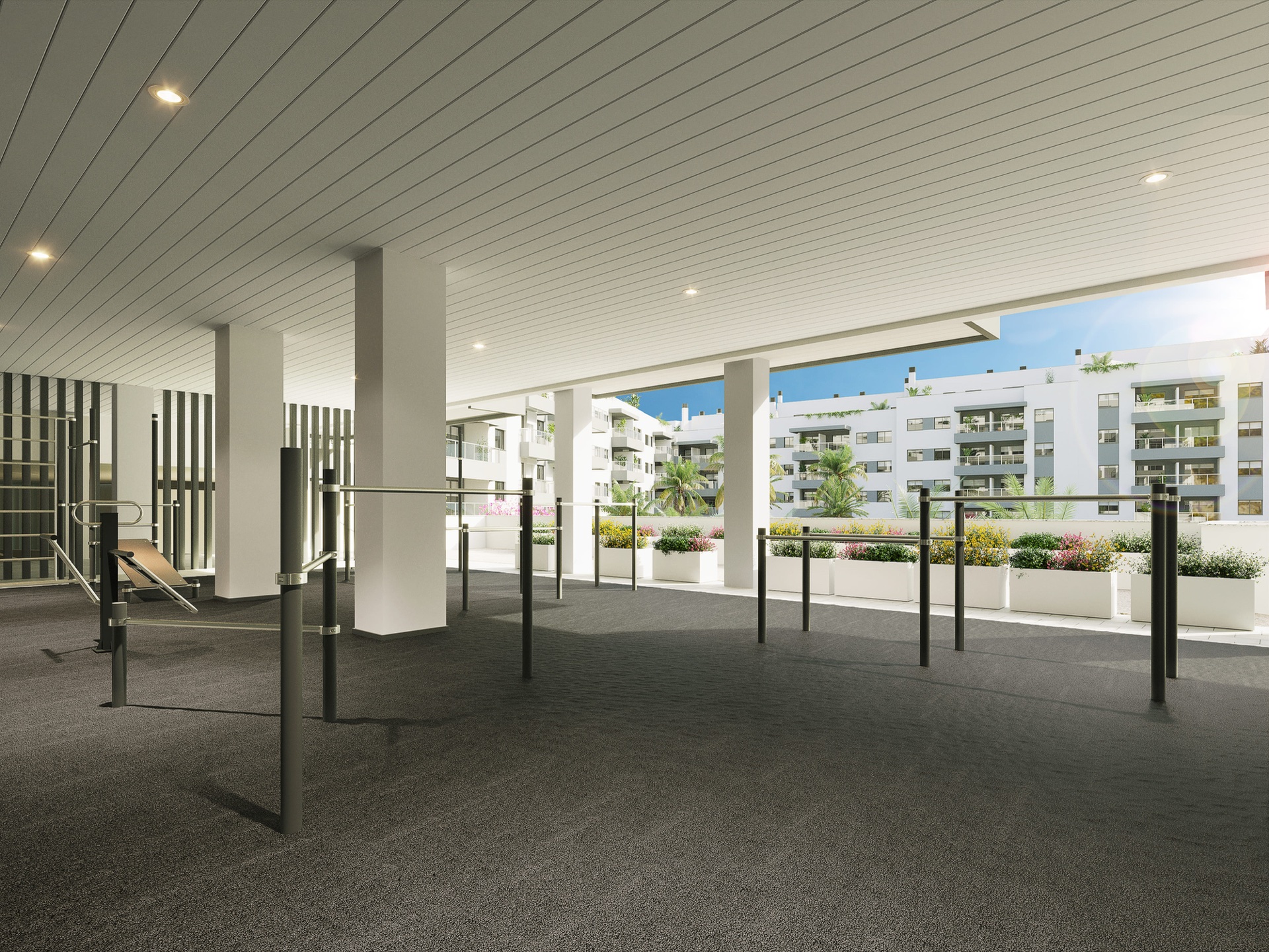 The covered exercise area under the building, open along one side to the gardens. Suite Mijas Phase Two, Las Lagunas de Mijas, Mijas.