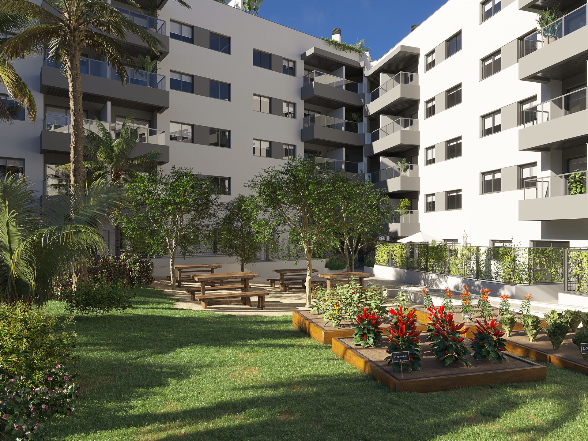 The raised growing beds in the gardens, planted up beside a bench and a shaded seating area. Suite Mijas Phase Two, Las Lagunas de Mijas, Mijas.