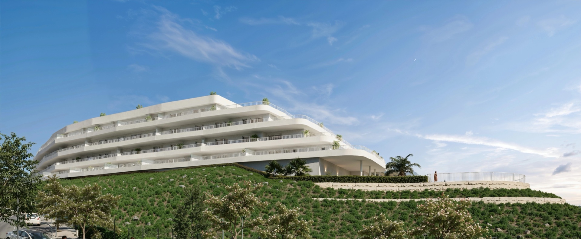 The building seen from the hillside below, stepping down the slope in terraces. Sunset Views, Los Pacos, Fuengirola.