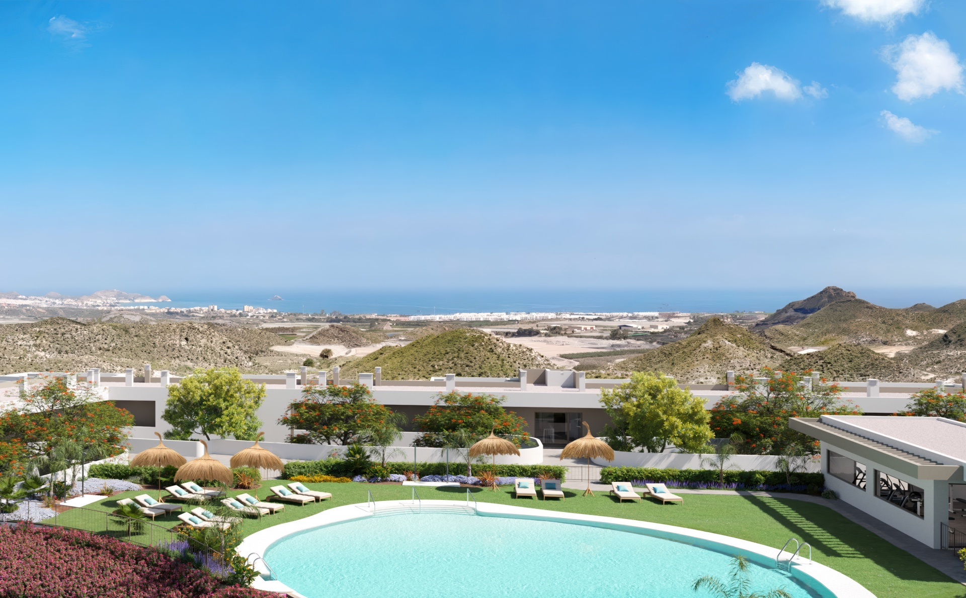 A second pool, raised above the gardens, with the sea and the coastline beyond. Swing Golf, Pilar de Jaravía, Pulpí.