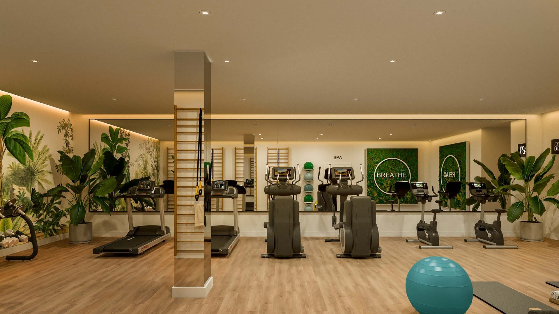 The gym, its machines and weights arranged under a tall window with plants along the back wall. Las Terrazas de Cortesín Bon Air, Finca Cortesín, Casares.