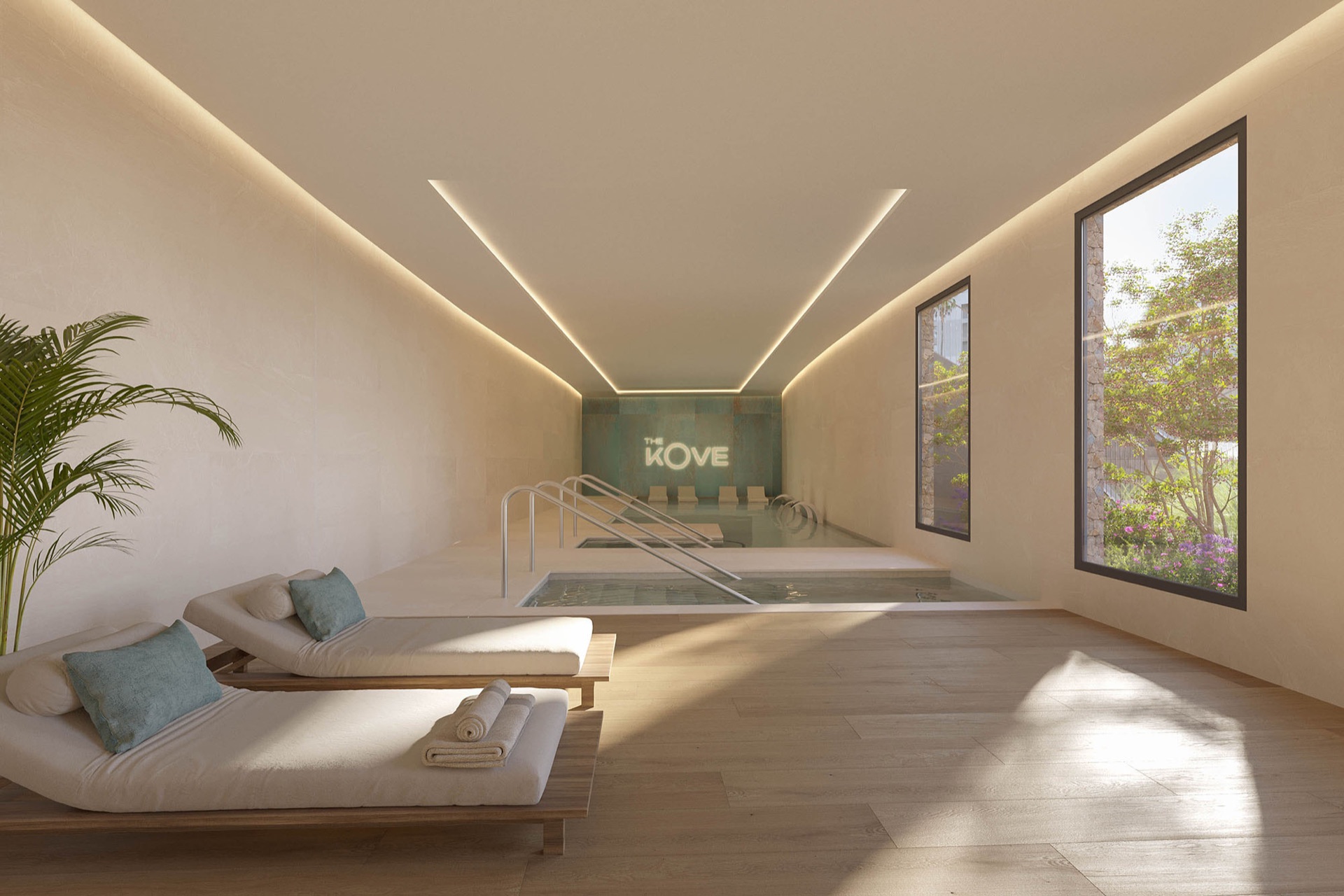 The indoor pool in the spa, with loungers along one side under lines of light in the ceiling. The Kove, Hipódromo, Mijas.