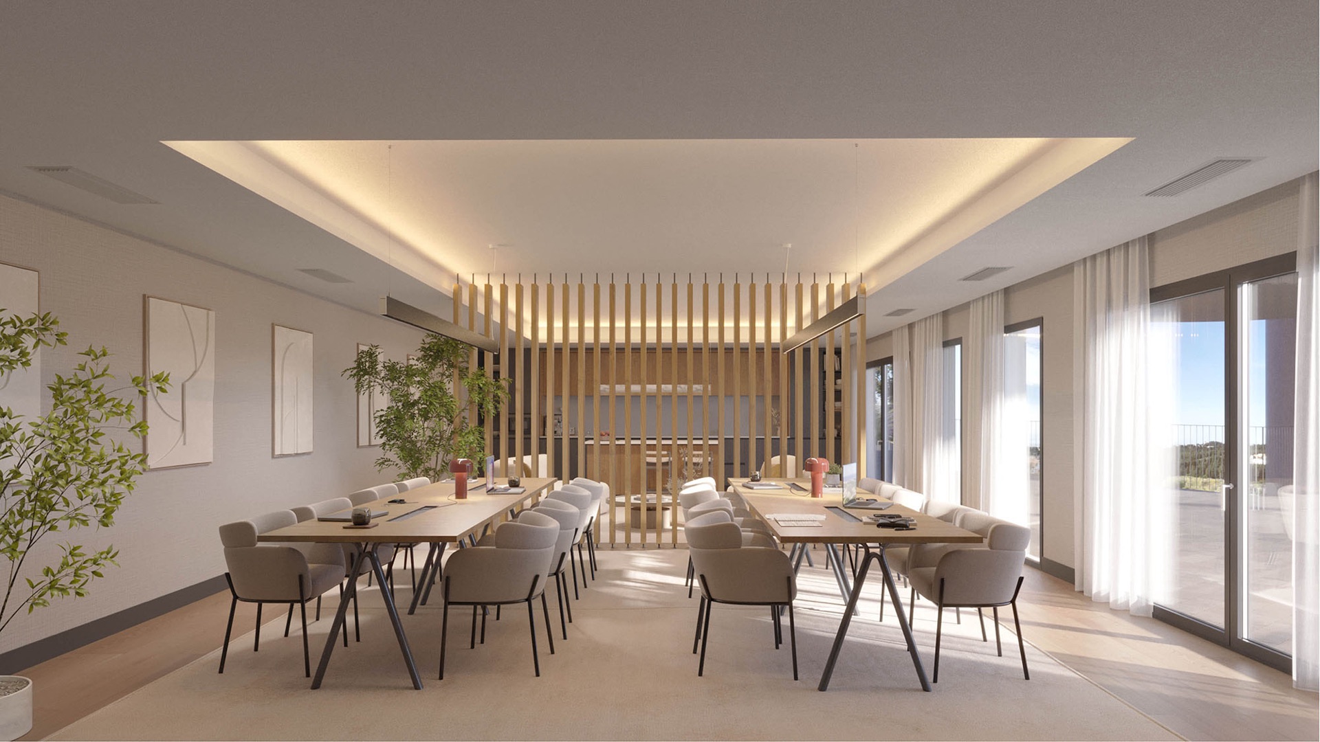 The coworking room, with two long tables and a kitchen counter at the far end. The Kove, Hipódromo, Mijas.