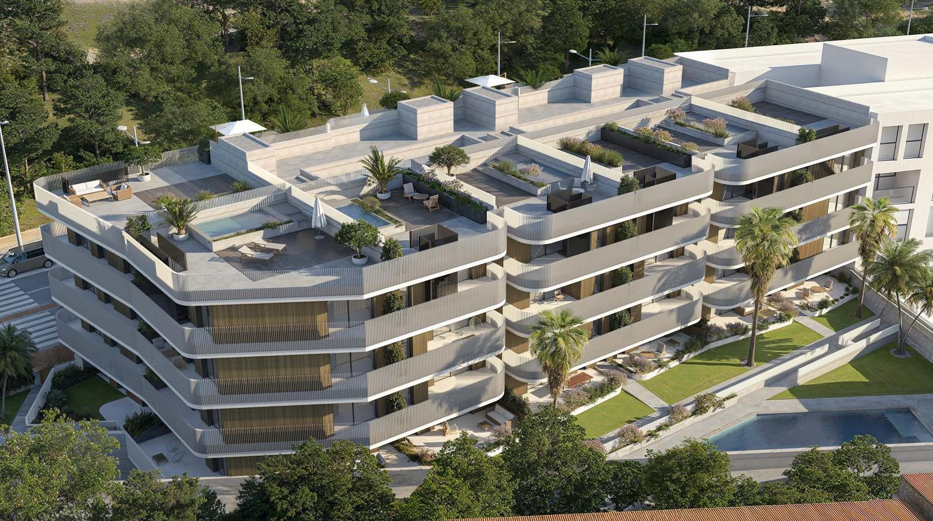 An aerial view of the penthouse roof terraces, some with a small private pool, with the gardens and the communal pool below. The Oak 48, El Calvario, Estepona.