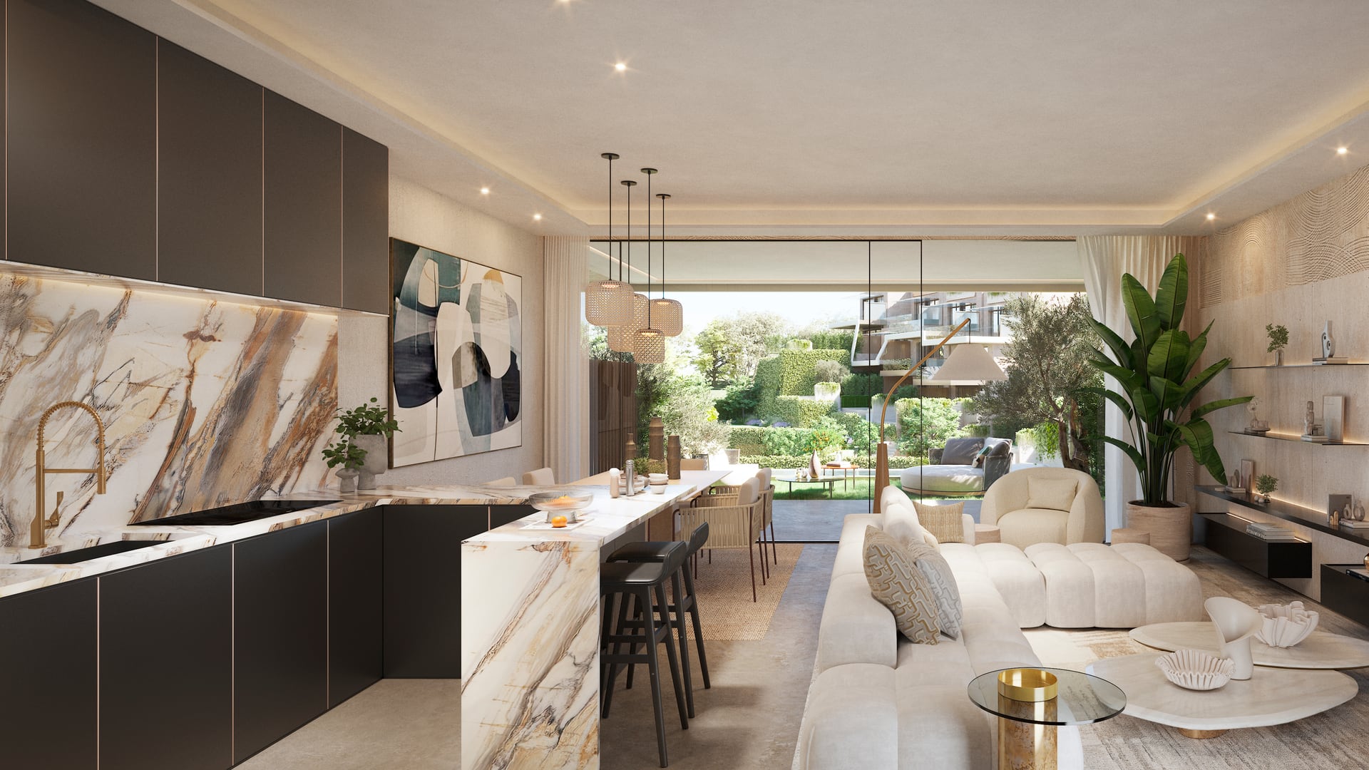 The open-plan kitchen and living room, with dark units, a veined stone splashback and island, and glass doors to the garden at the far end. The Valley, Elviria, Marbella.