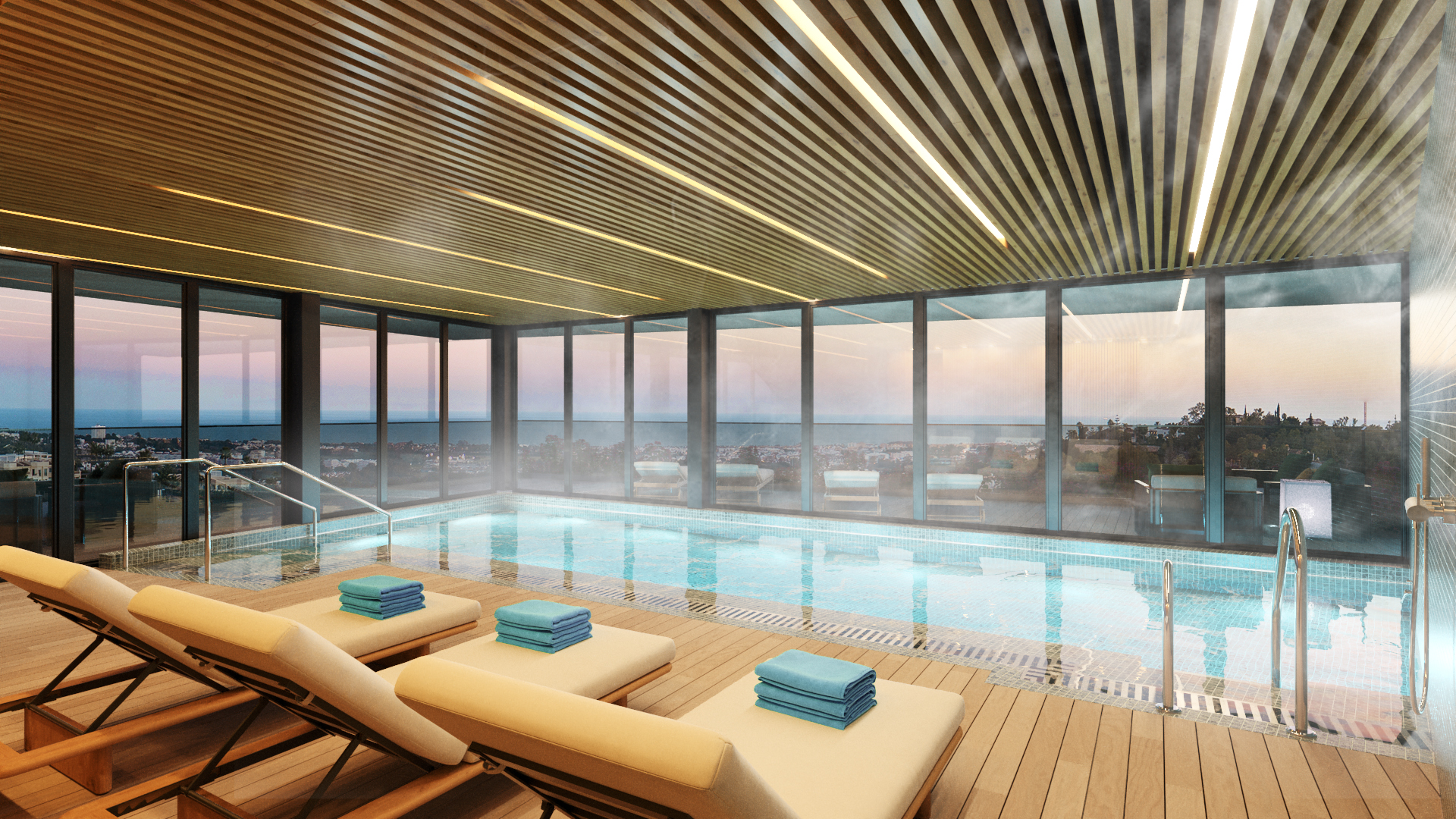 The indoor pool, under a slatted timber ceiling, with glass walls looking out over the valley. Tiara, La Quinta, Benahavís.