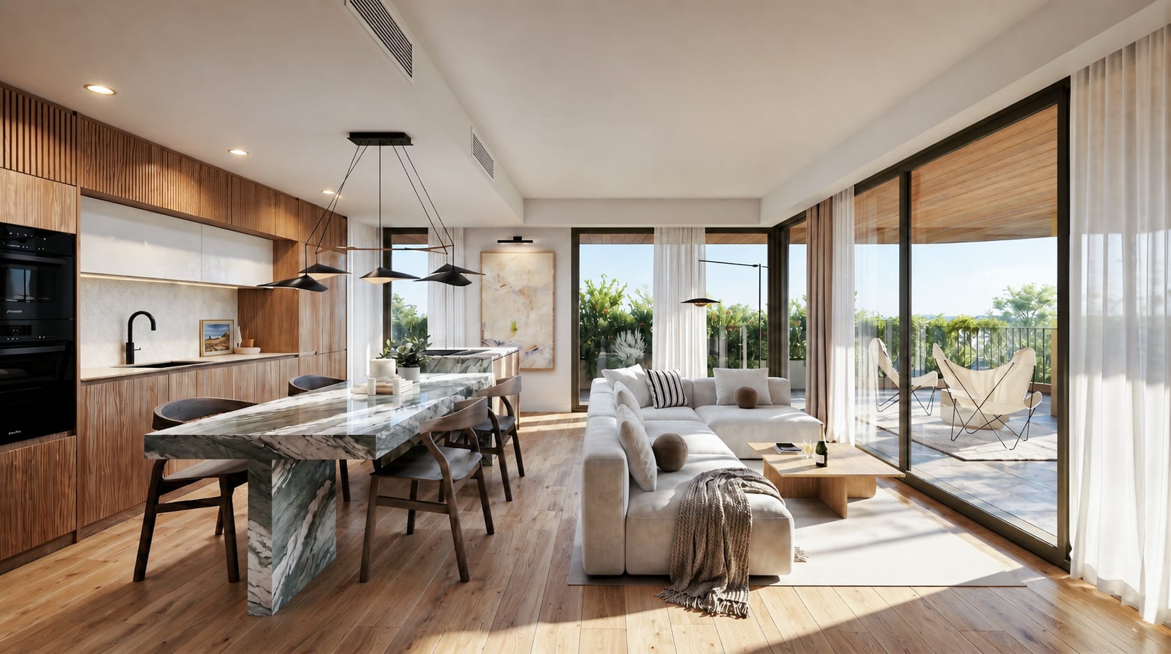 A kitchen and living room as one space, with timber-fronted units, a dining table in green-veined stone and glass doors onto the terrace. Vangård, Los Pacos, Fuengirola.