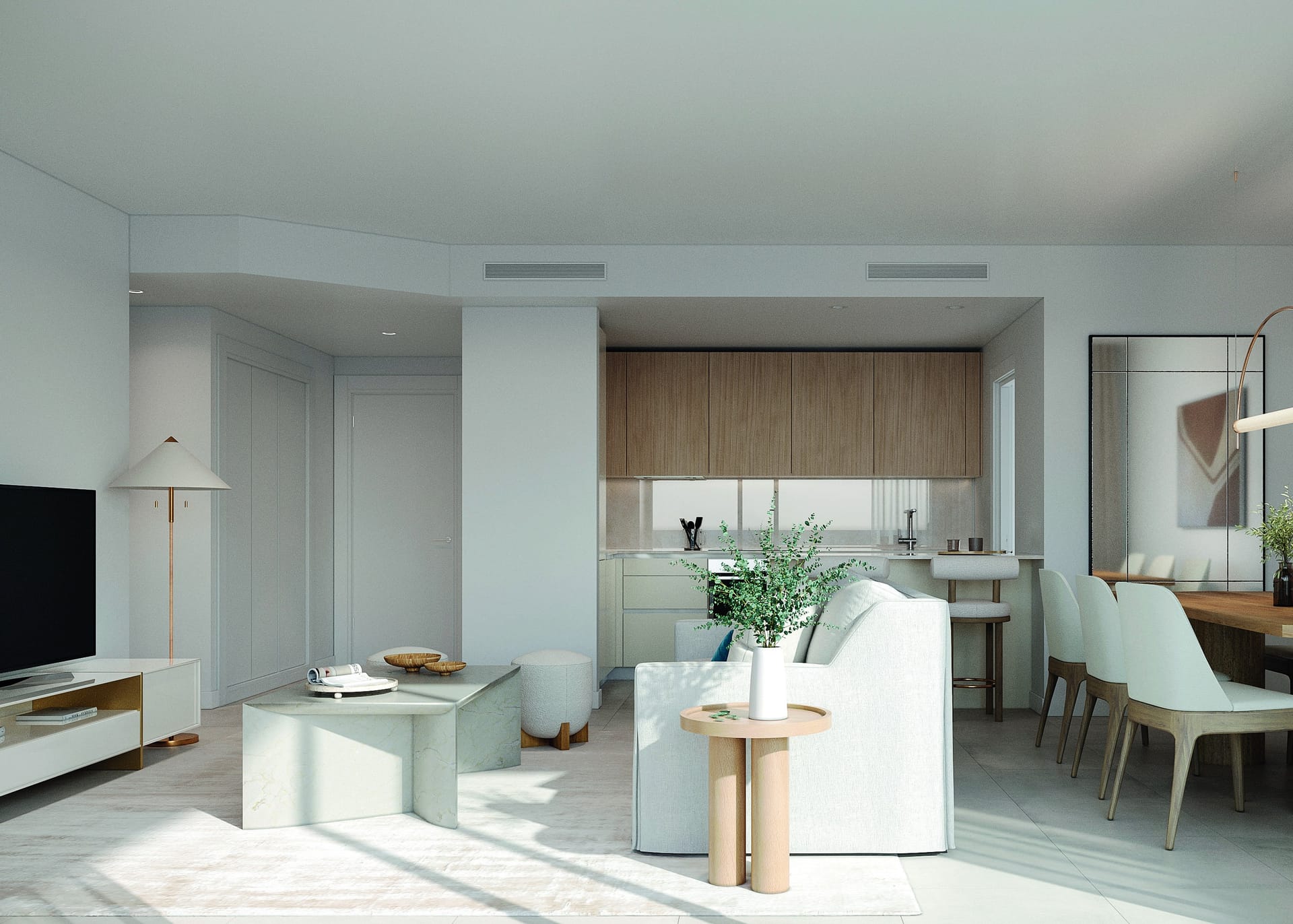 A living room open to the kitchen, with the dining table beside it. Vanian Gardens V, La Resina, Estepona.
