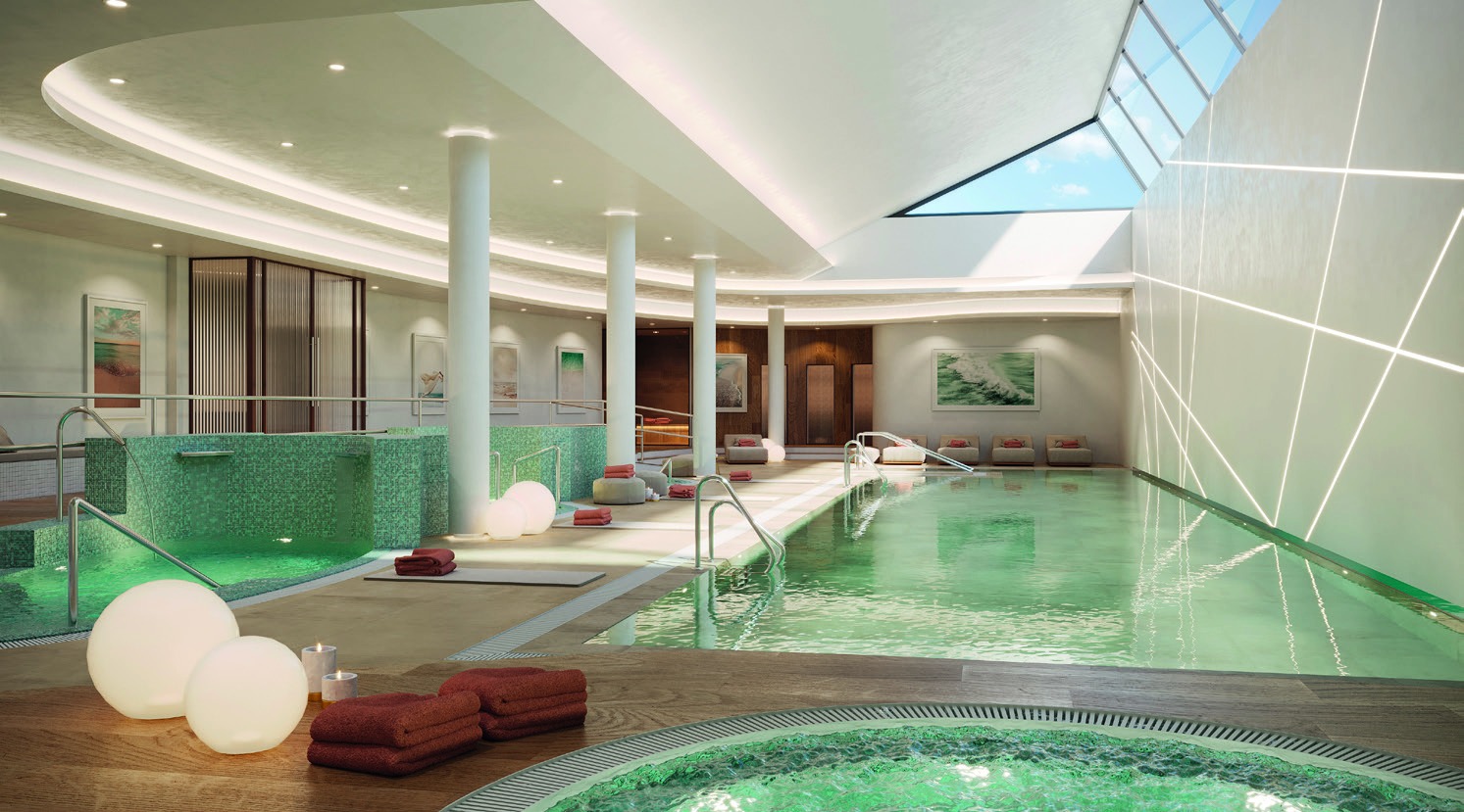 The indoor pool in the spa, with a round jacuzzi in the foreground and a skylight above. Vanian Gardens V, La Resina, Estepona.