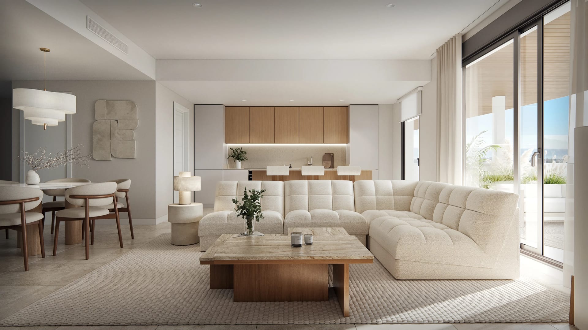 A living room with a corner sofa, the dining table to one side and the kitchen behind. Vanian Park, La Resina, Estepona.